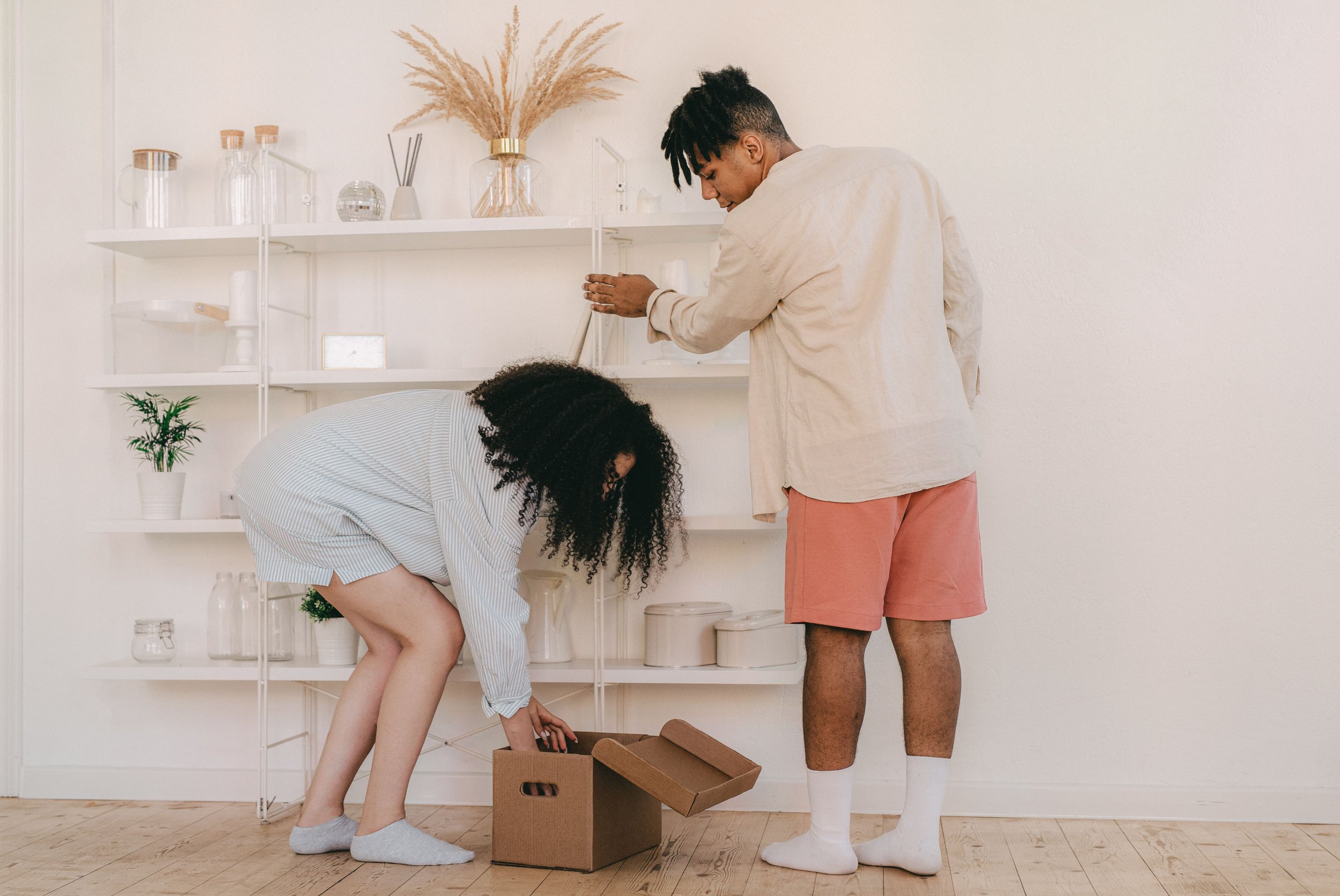 a woman putting something in a box