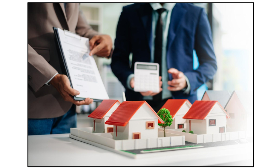 Investor discussing DSCR loans for rental properties with calculator and house model