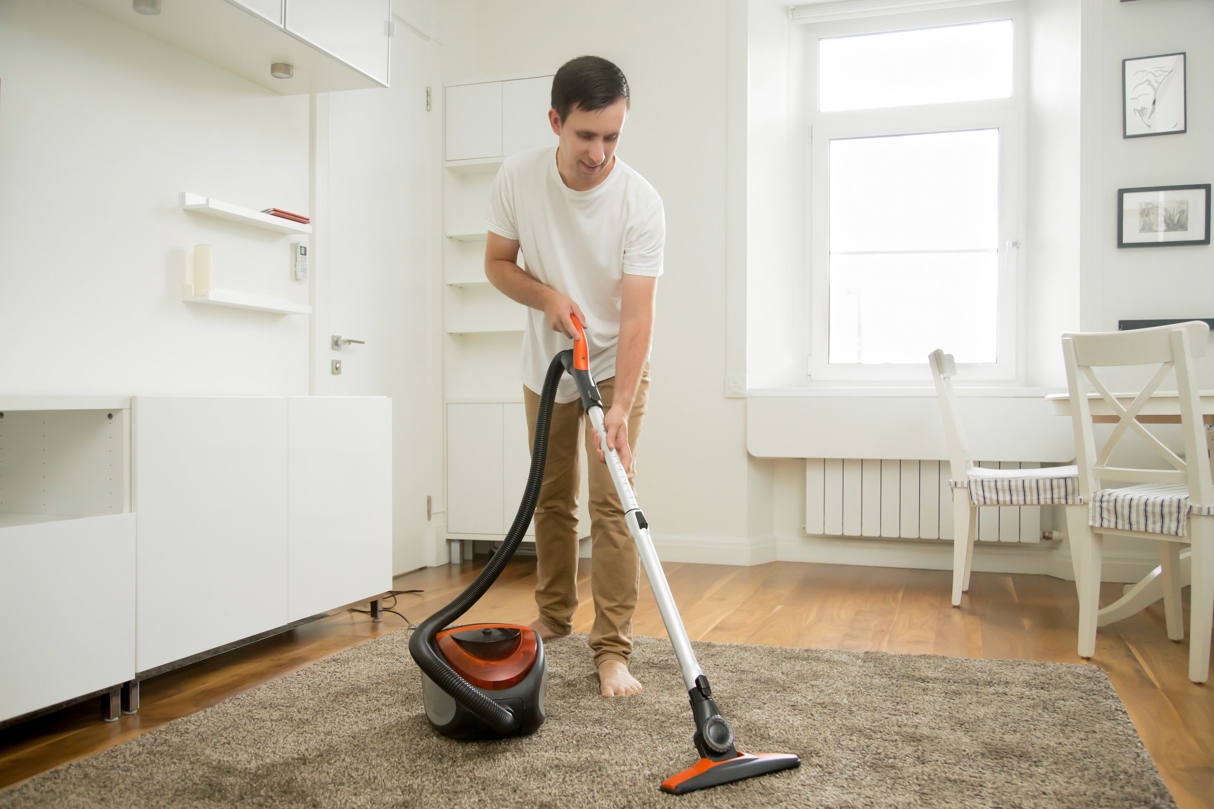 happy-smiling-man-cleaning-carpet.jpg