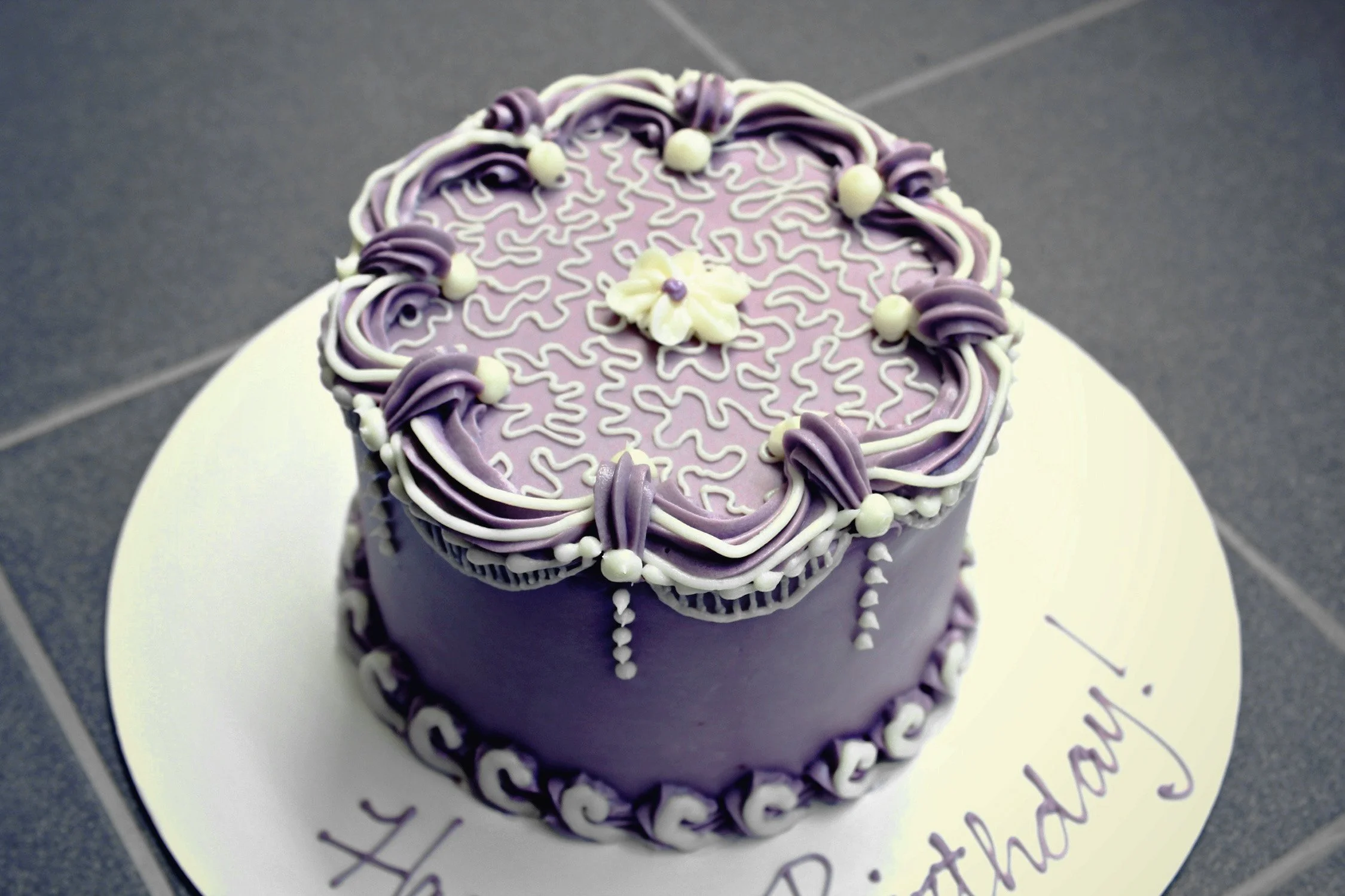 Purple overpiping cake for website.jpg