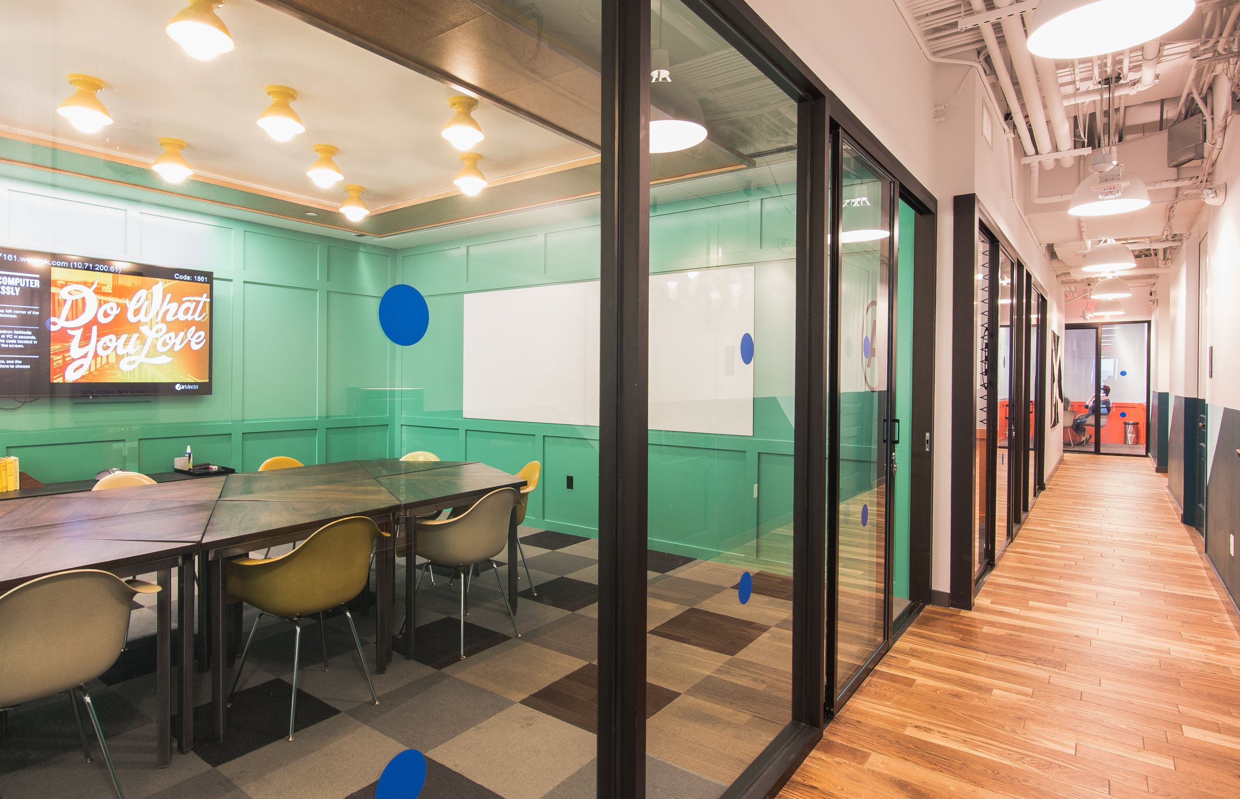 A hallway of different sized conference rooms.