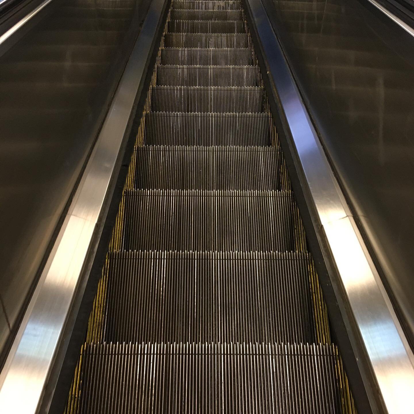 Escalator.  #pointofview #metal #escalator #nyc Brooklyn #texture #artistsoninstagram #symmetry