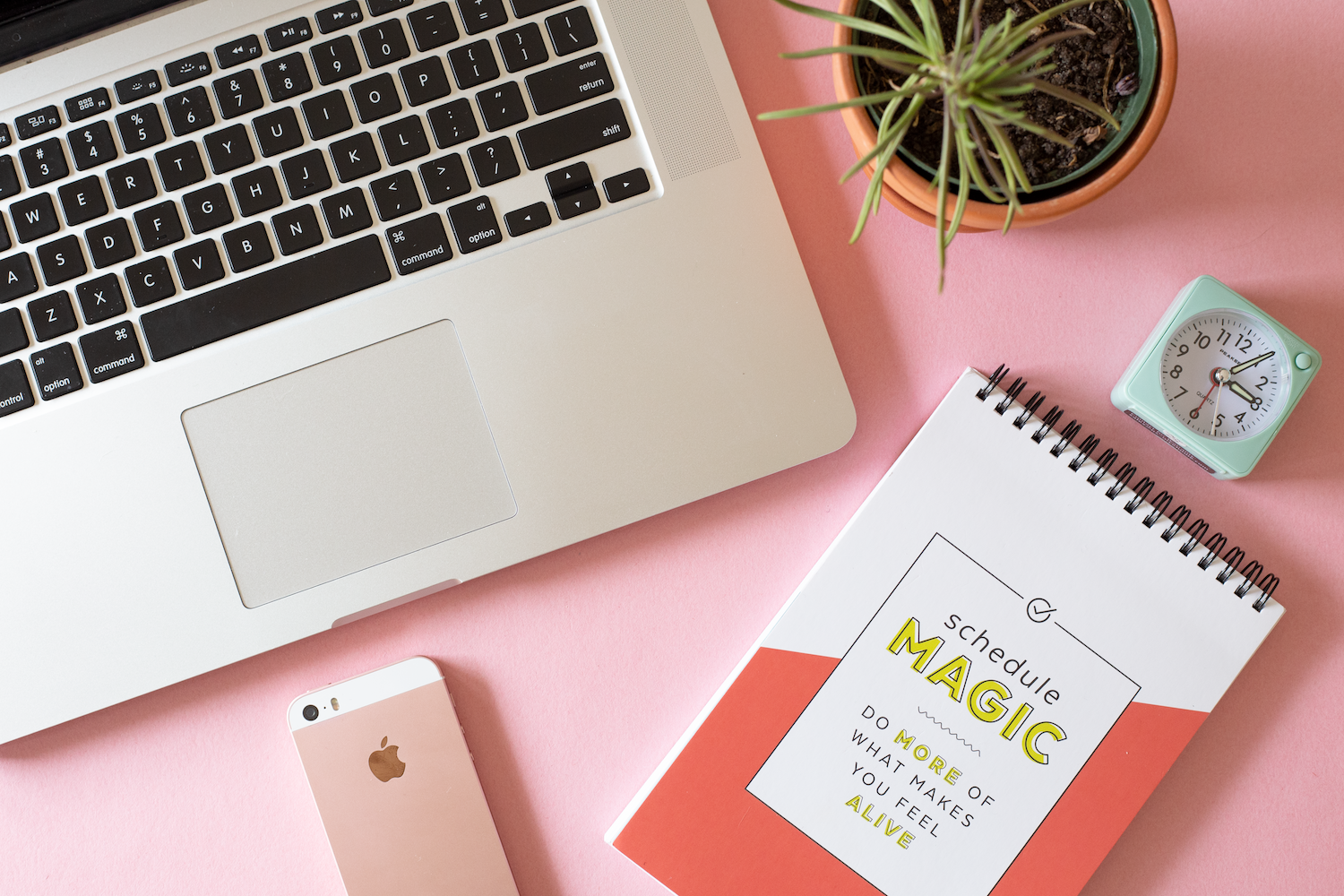 Laptop, iPhone, and Free Period Press “Schedule Magic” planner