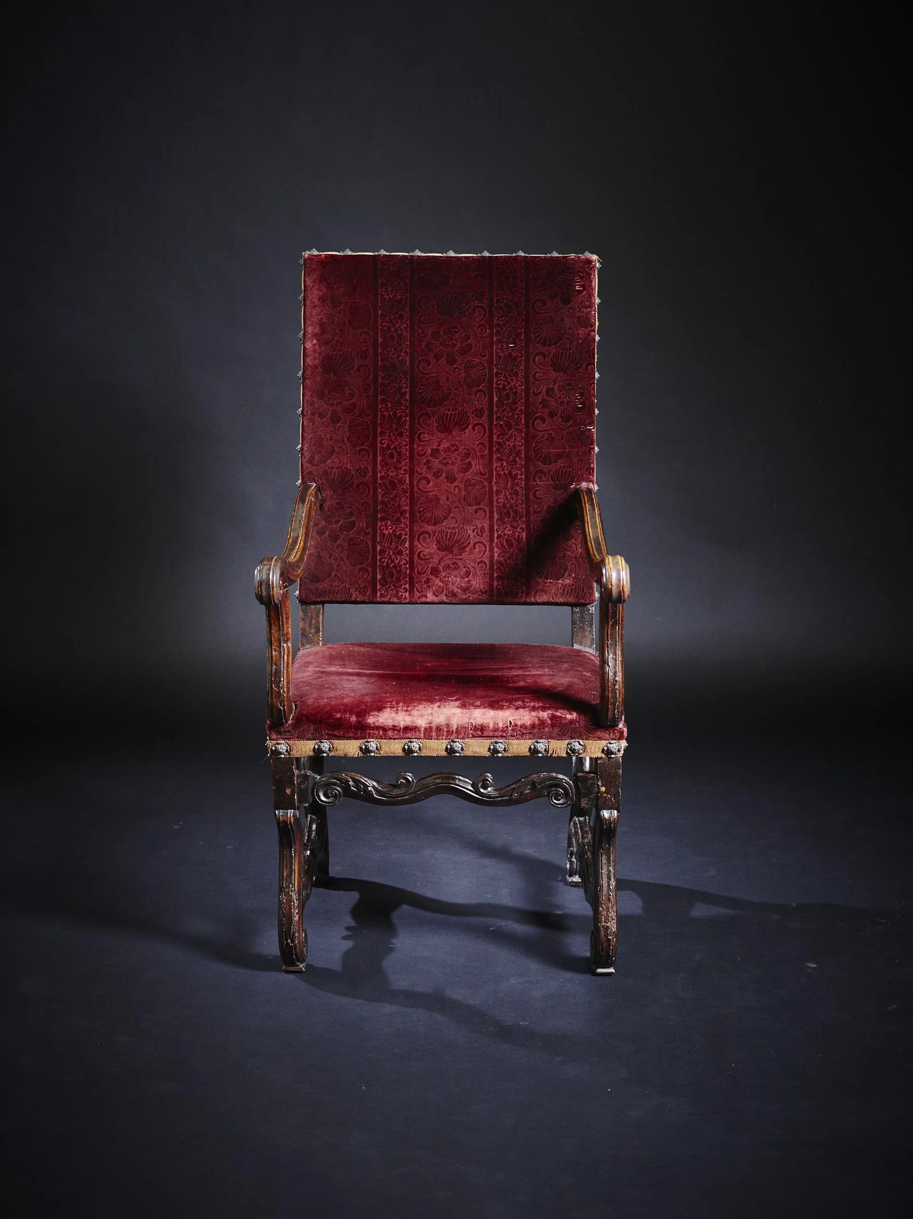 A pair of Louis XIV walnut fauteuils.