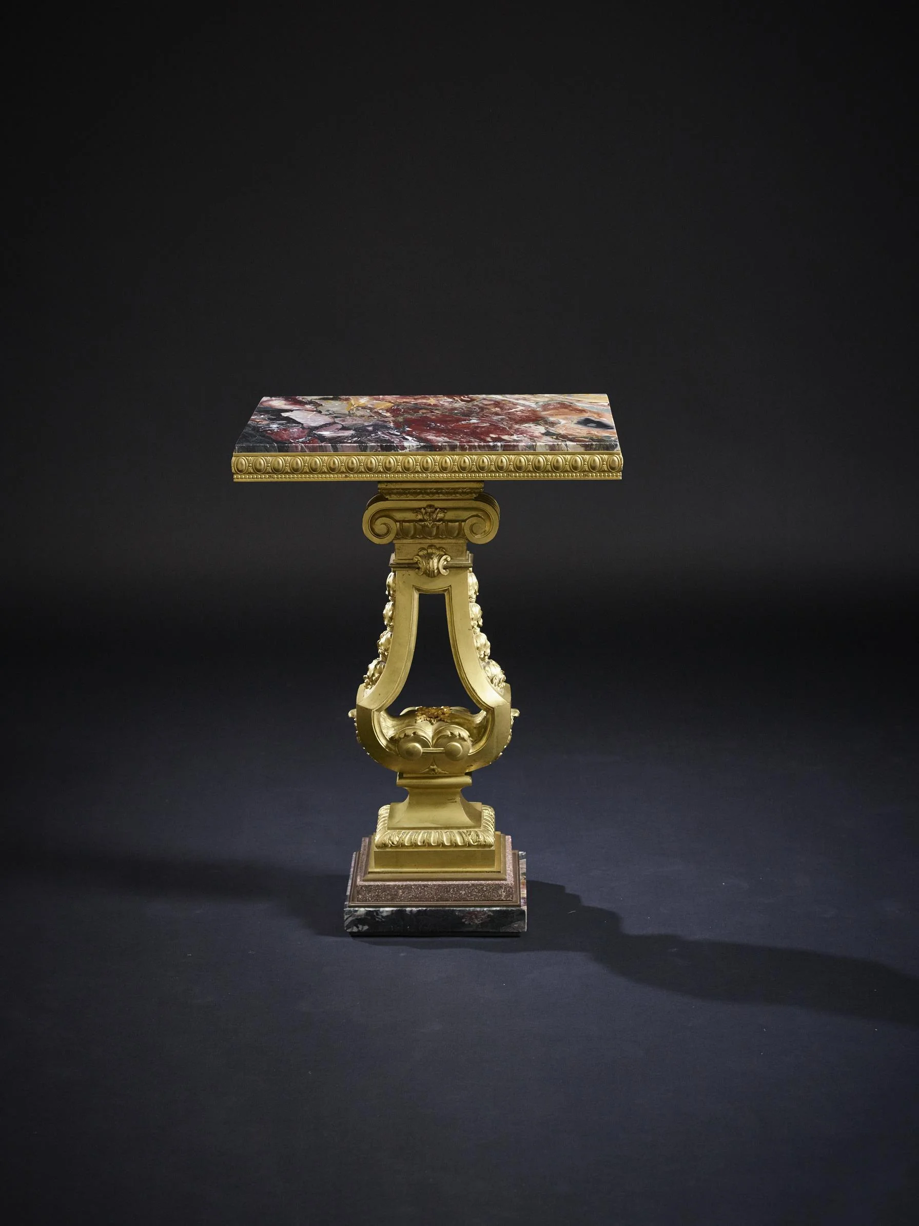 A fine quality early 19th century Swedish ormolu, marble and porphyry centre table, circa 1825.