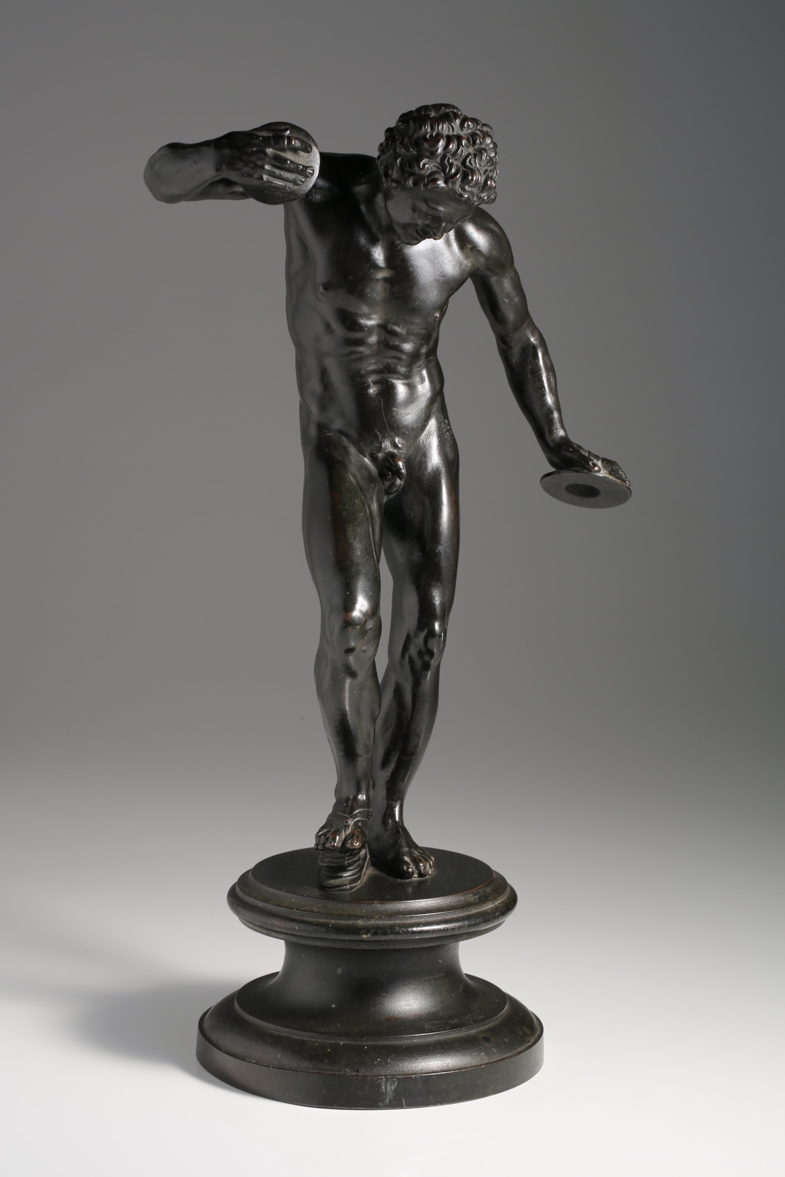 bronze dancing faun with clappers