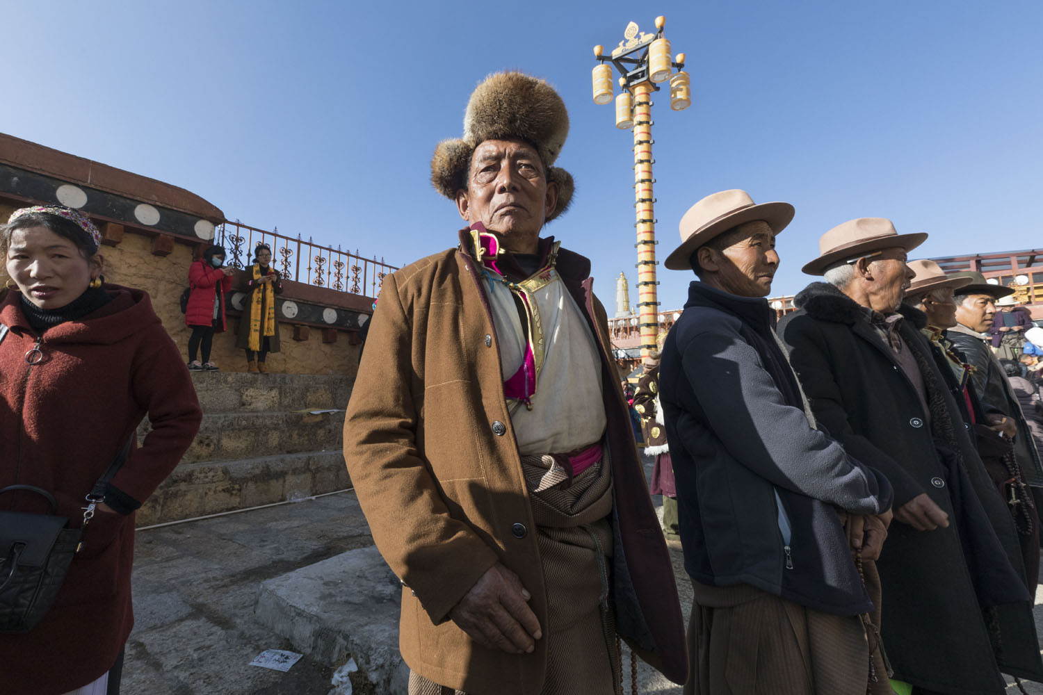 Man dressed in traditional Tibetan clothing at SongZangLin Monastery in JingXiang Village. Yunnan, China. March 2, 2018.