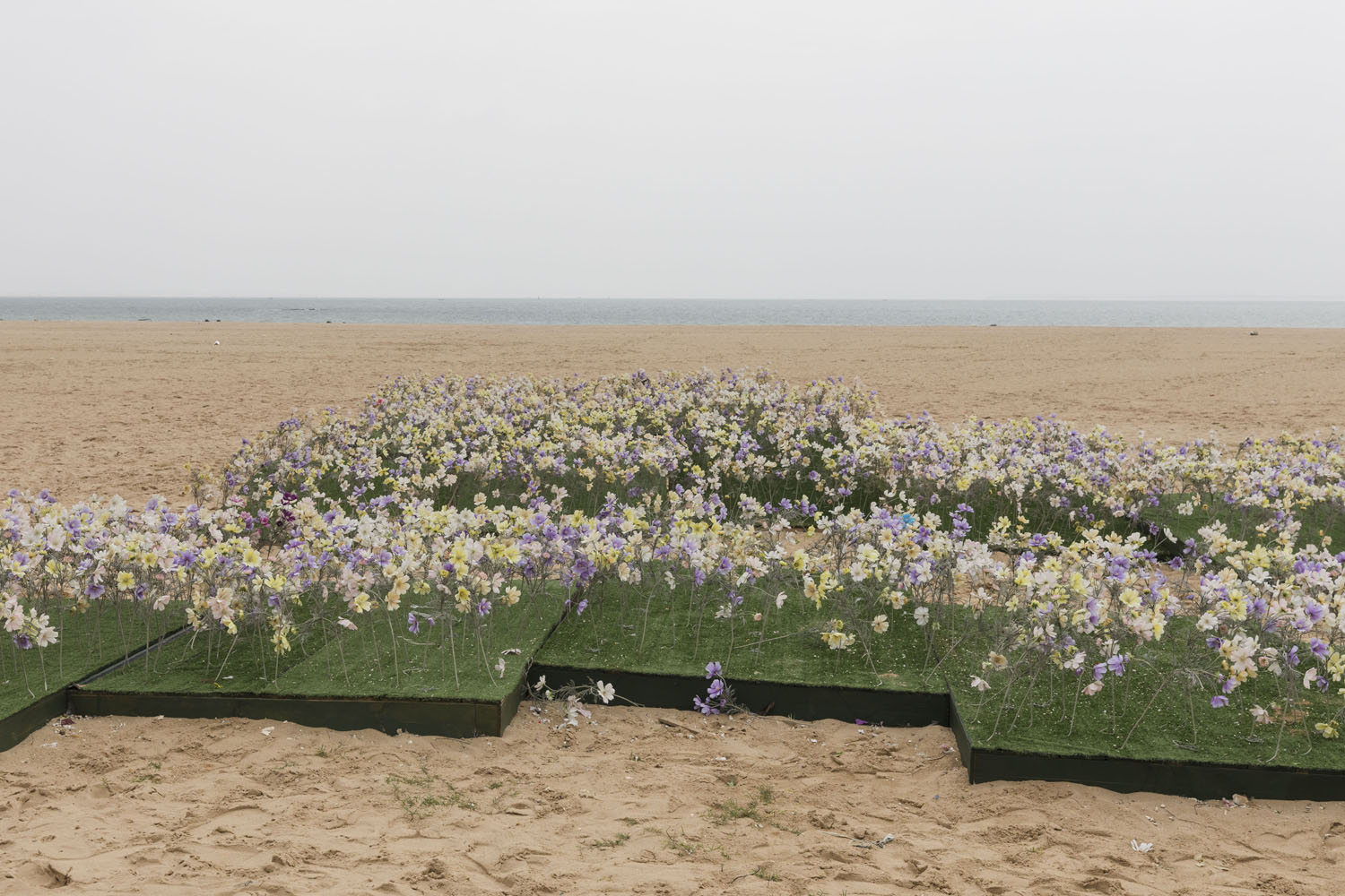 Imitation flower beds used for wedding photography at Guanyinshan Fantasy Beach. Xiamen, China. 2018.