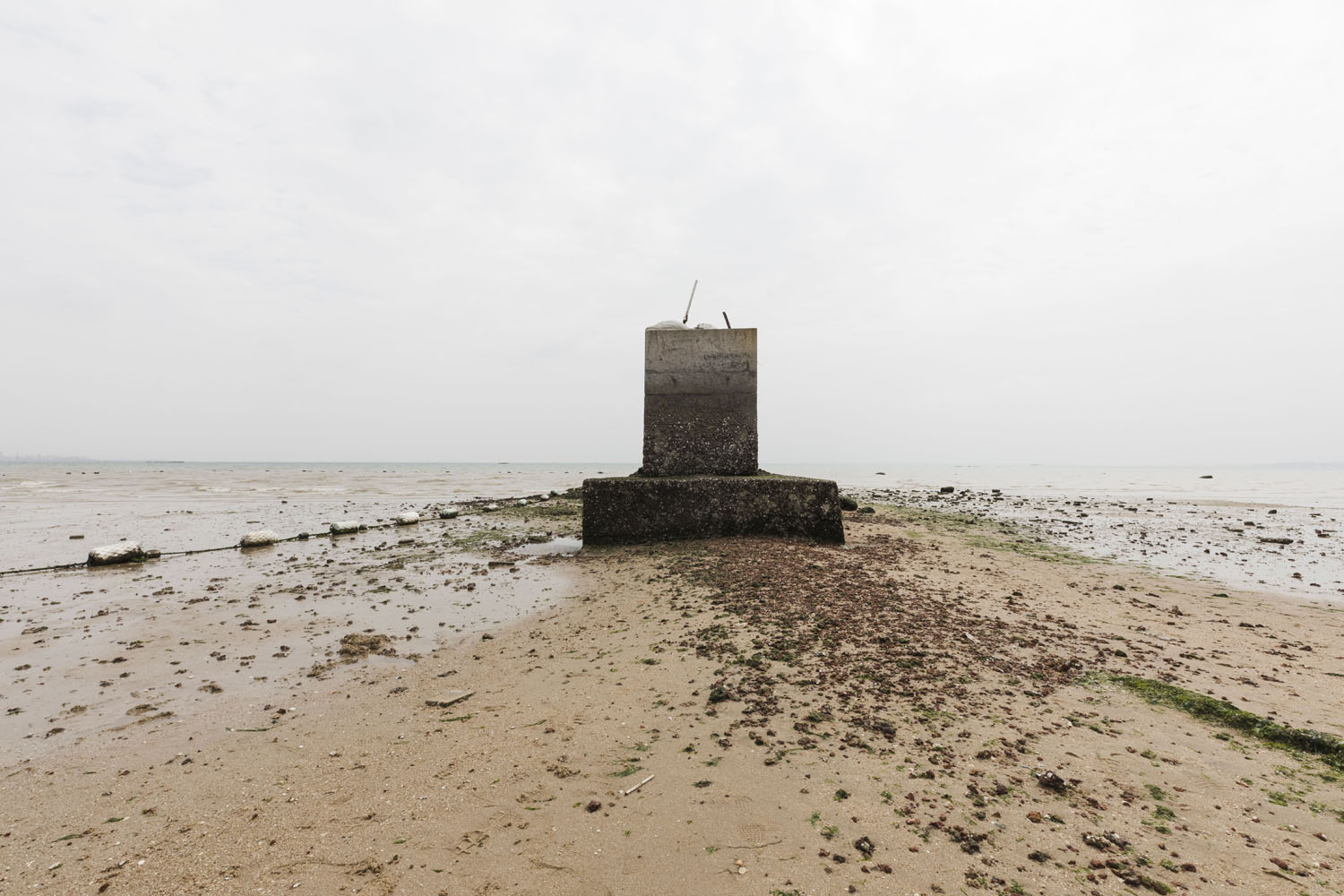 An abandoned pillar at Guanyinshan Fantasy Beach. Xiamen, China. 2018.