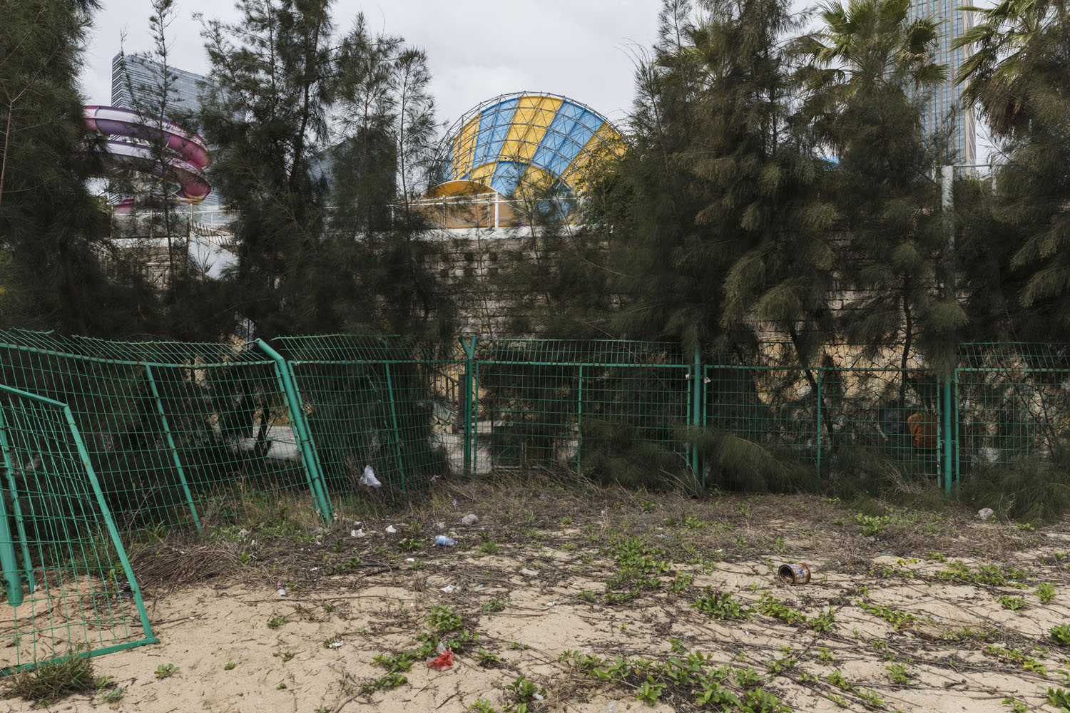 View of the waterpark from inside a closed mini-golf course at Guanyinshan Fantasy Beach. Xiamen, China. 2018.