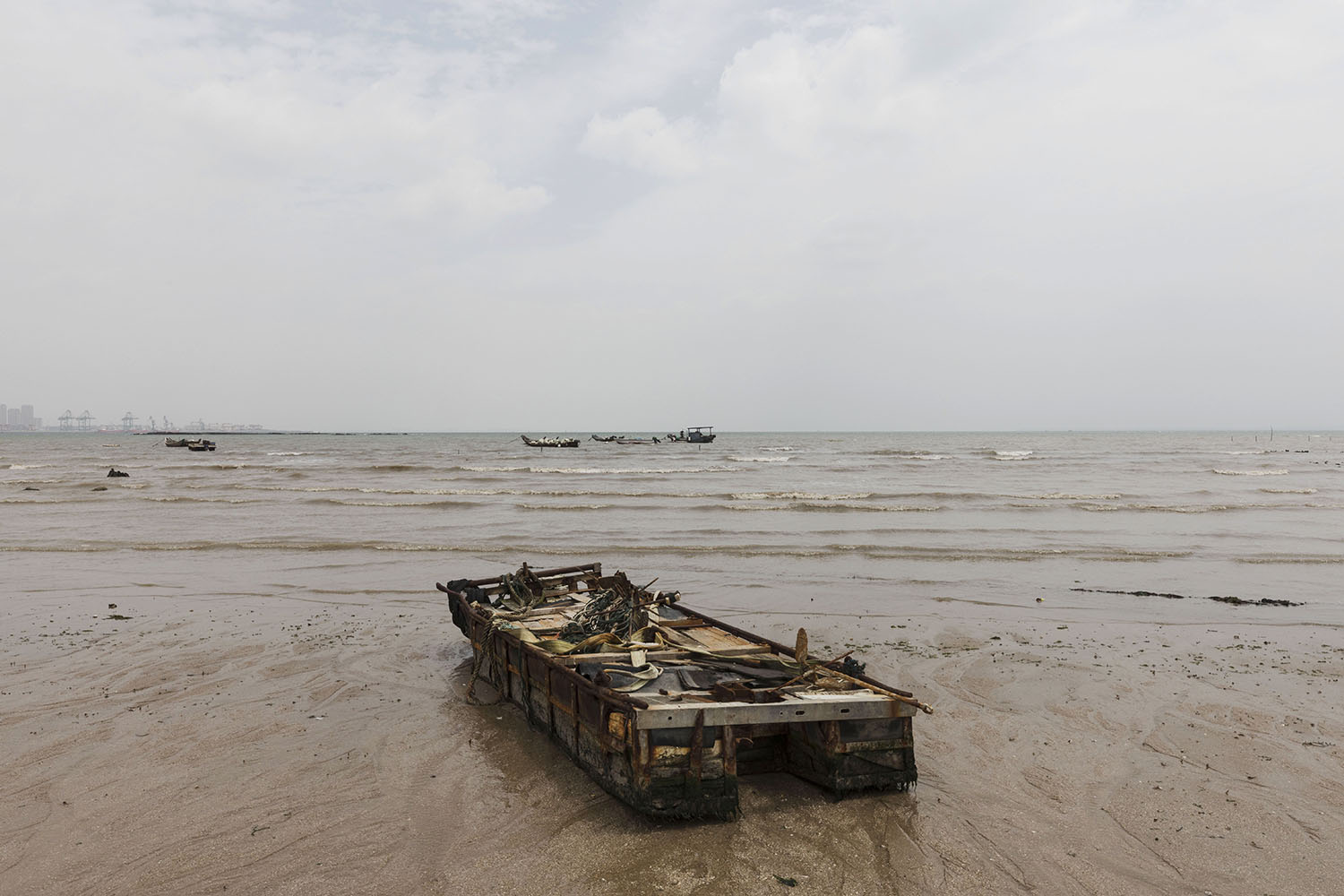 An abandoned hull at Guanyinshan Fantasy Beach. Xiamen, China. 2018.