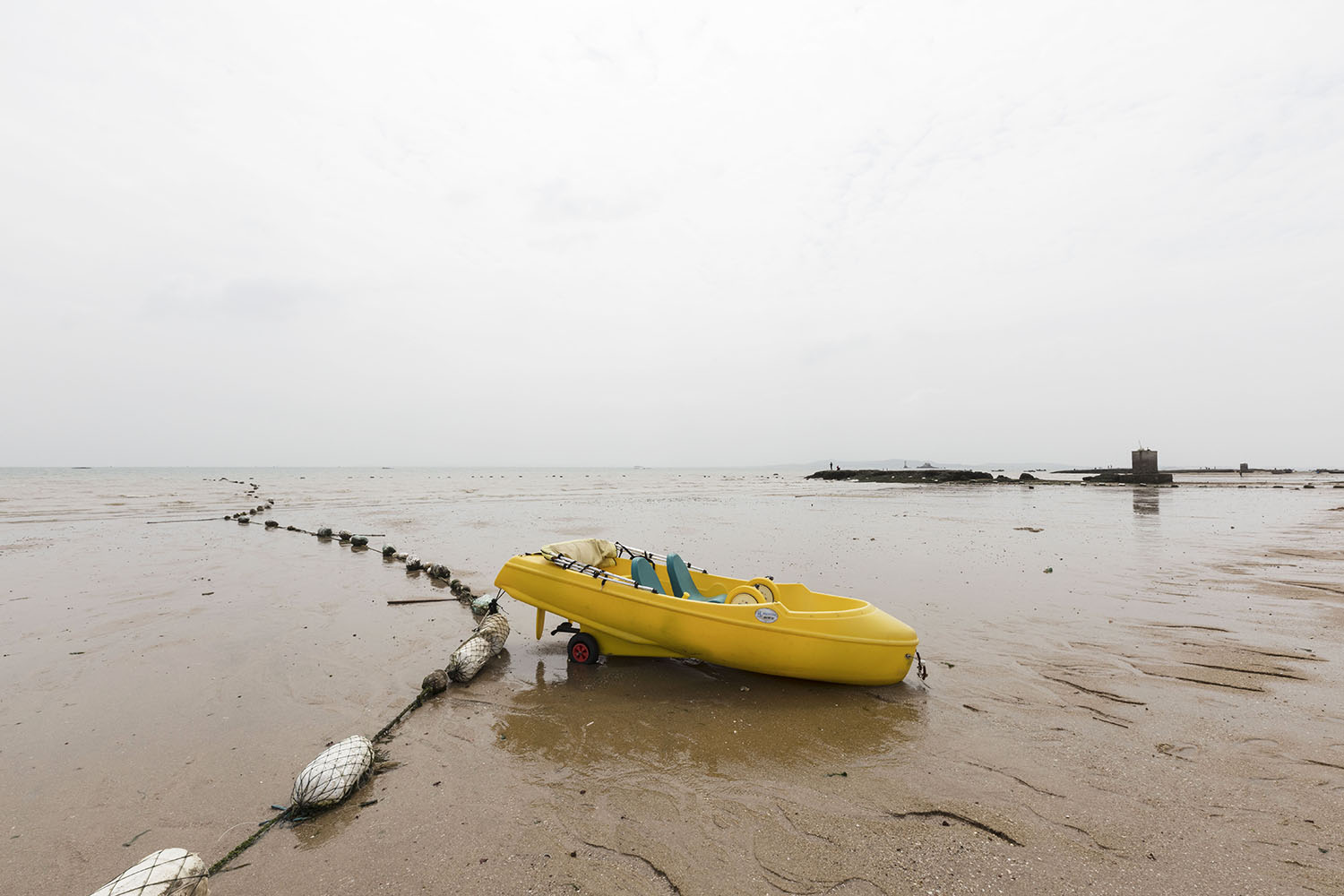 Small boat for tourists and beach goers at Guanyinshan Fantasy Beach. Xiamen, China. 2018.