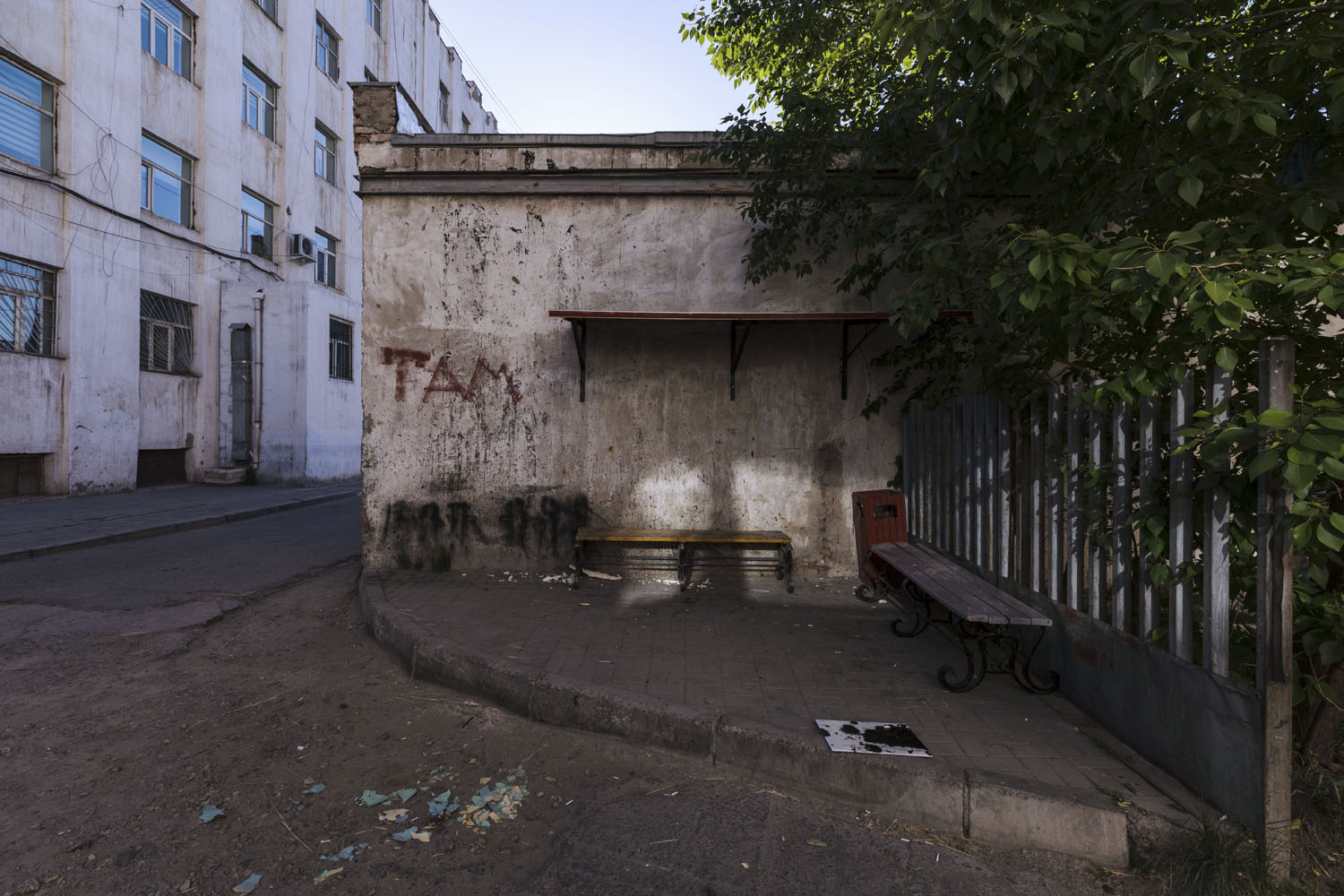 Bench area in a back alley. Ulaanbaatar, Mongolia. 2018.