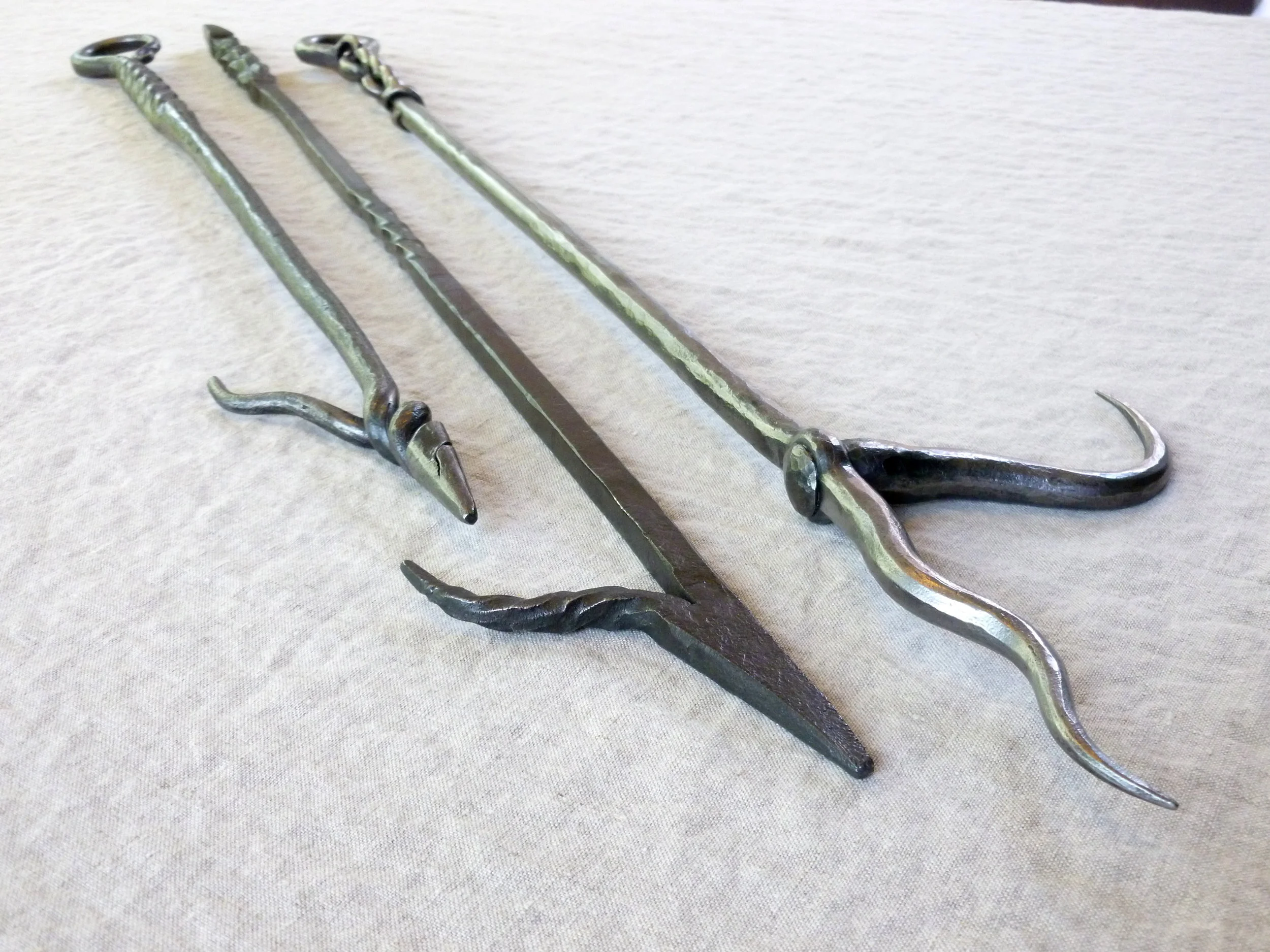 Trio of fireplace pokers (points)
