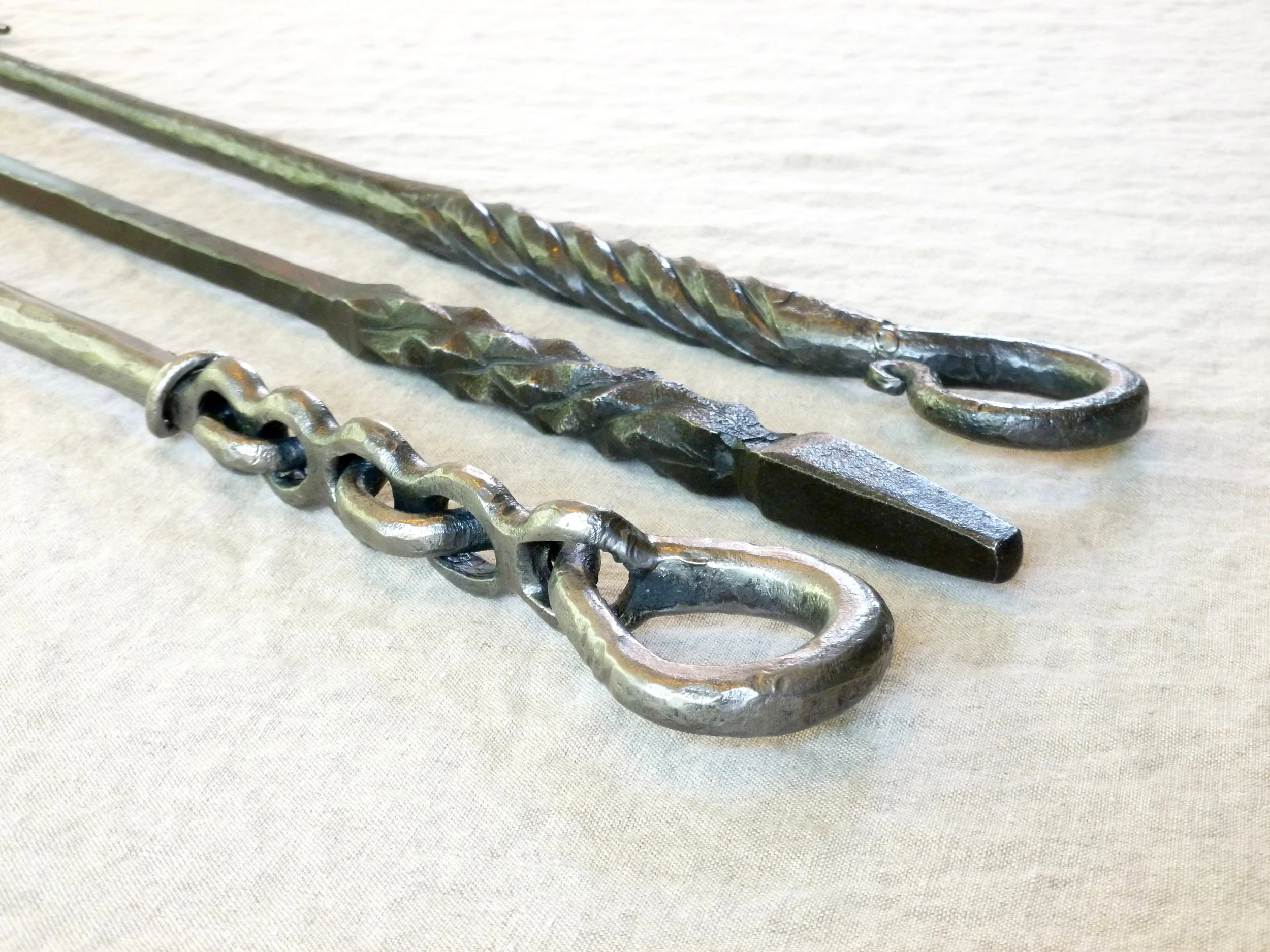 Trio of fireplace pokers (handles)