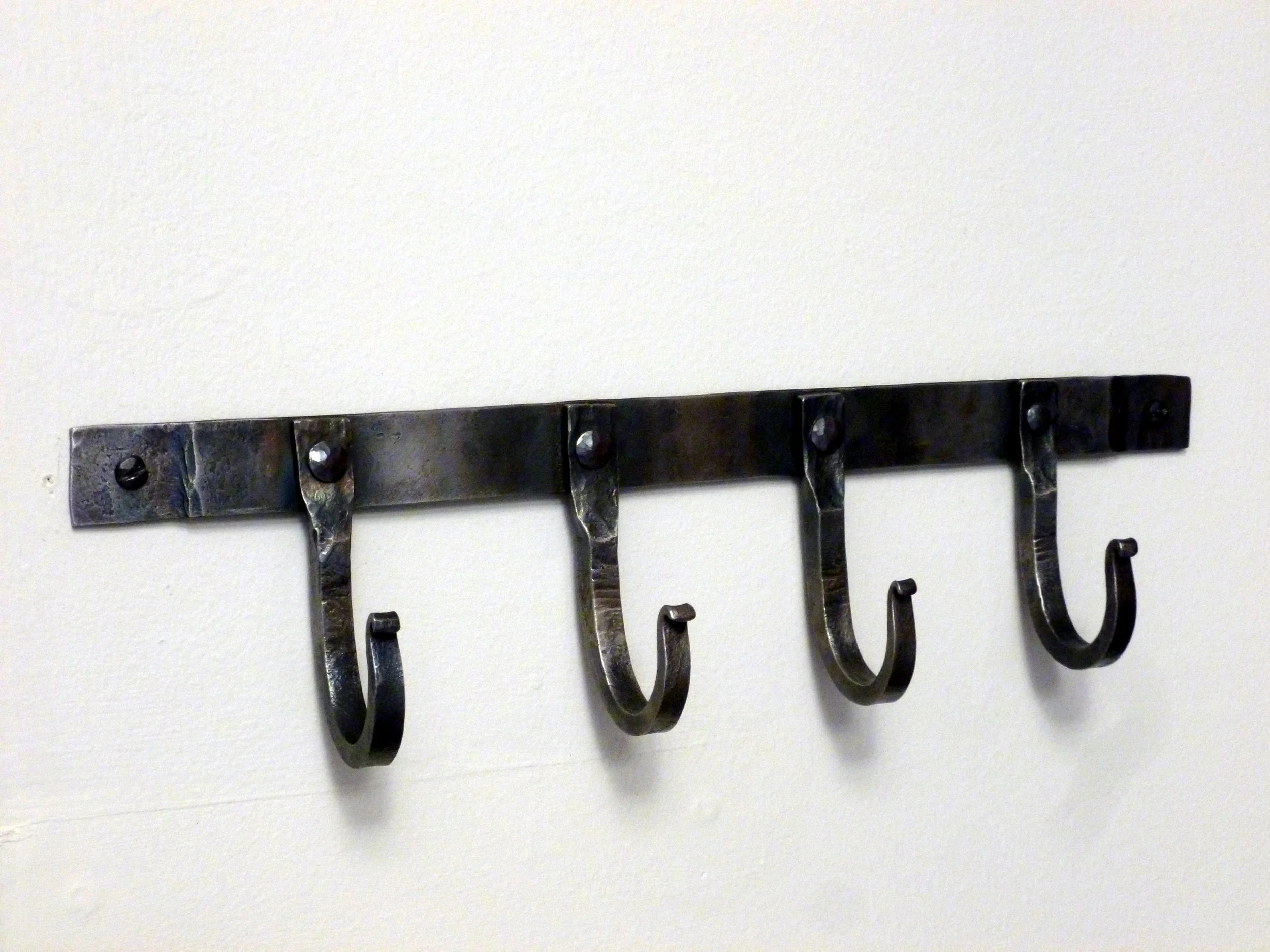Set of riveted steel hooks