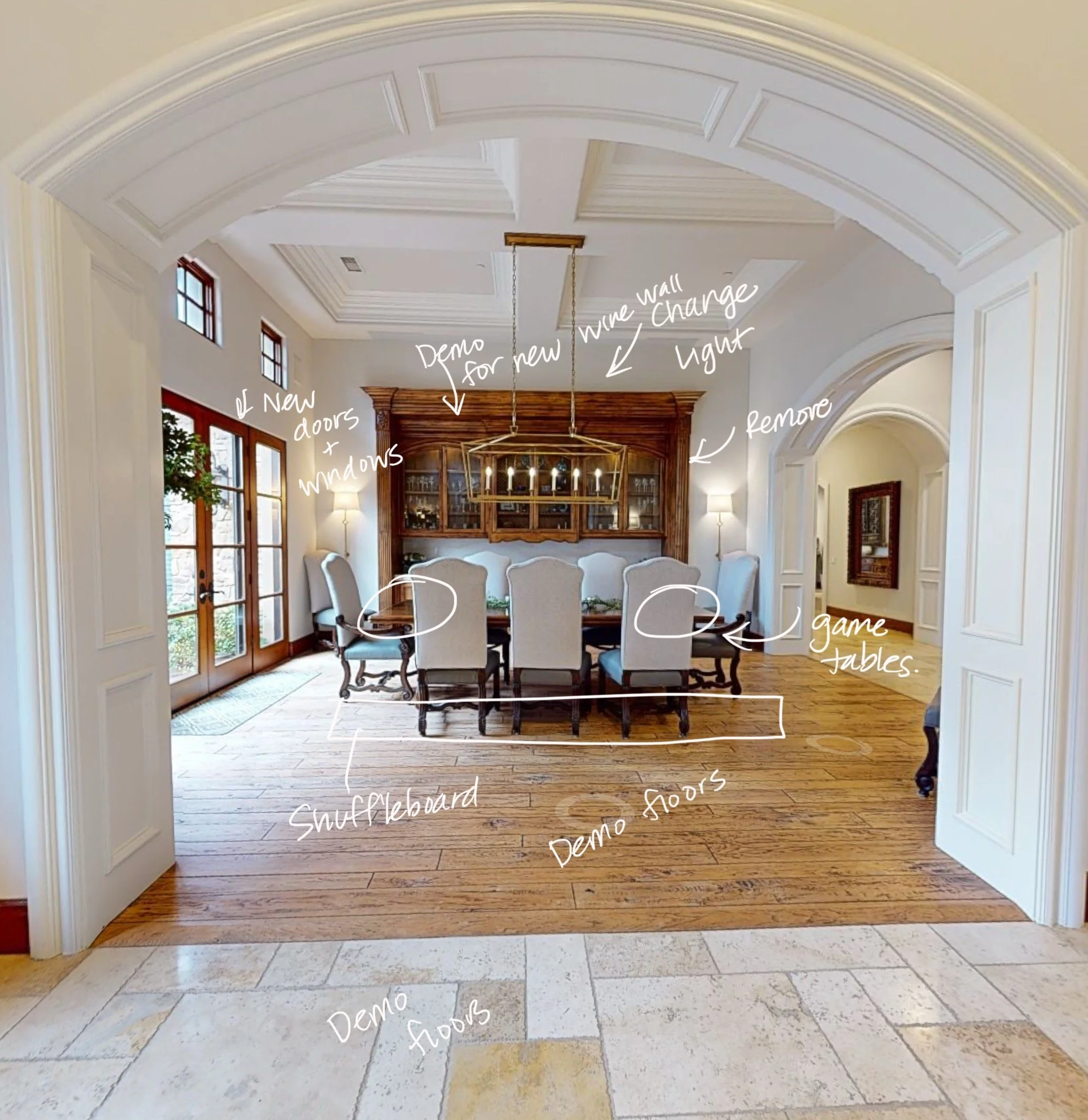 Interior renovation planning view by Savvy Interiors in Los Angeles, CA, showing a formal dining room with arched entryway, marked demo notes for flooring, lighting, wine wall, doors, and future game table layout.