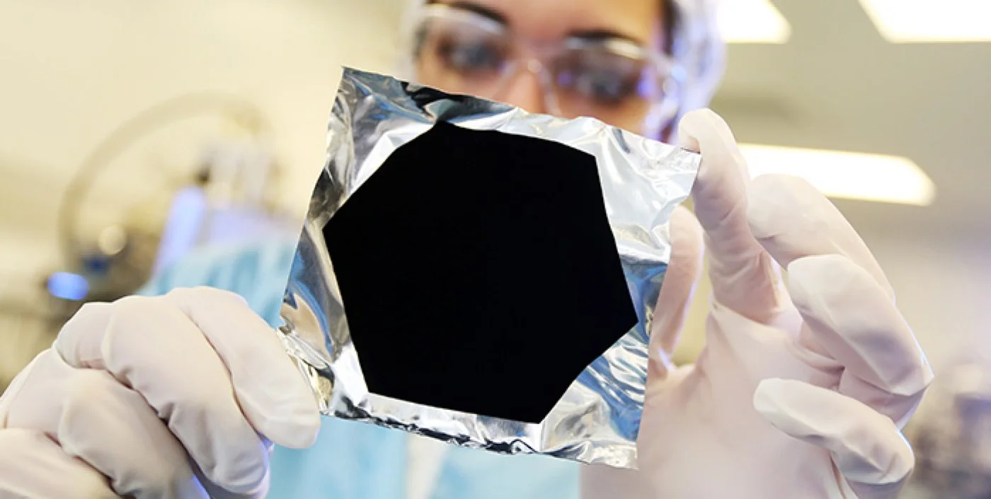 A PHOTO OF VANTABLACK ON CRUMPLED ALUMINUM FOIL FROM SURREY NANOSYSTEMS . I'M PROBABLY IN TROUBLE JUST FOR SHOWING IT TO YOU ON AN ART BLOG.