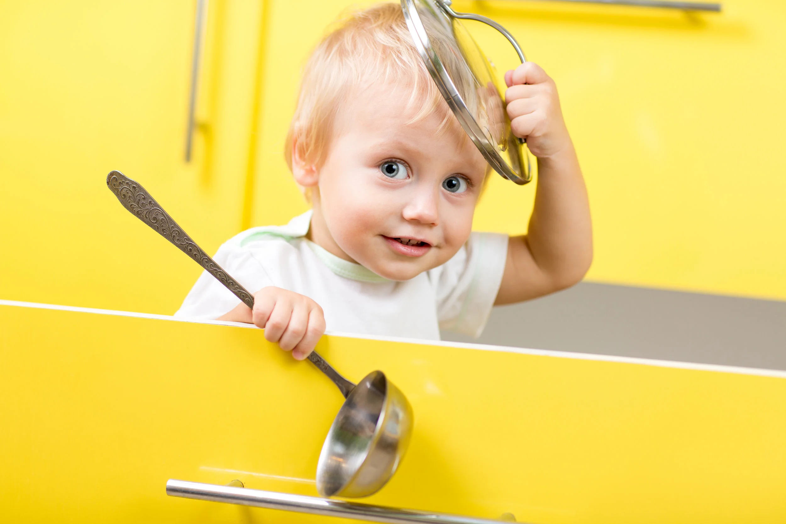bigstock-Kid-sitting-inside-yellow-open-106910210.jpg