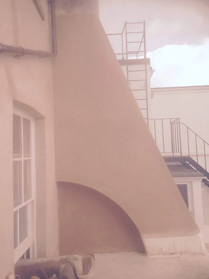 Lime rendered chimney stack at the rear of Sussex square.jpeg