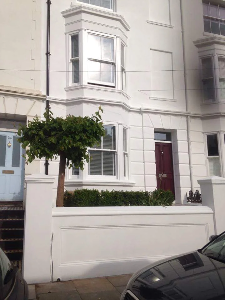 Painted rendering and mouldings on a front elevation in Clifton street.jpeg