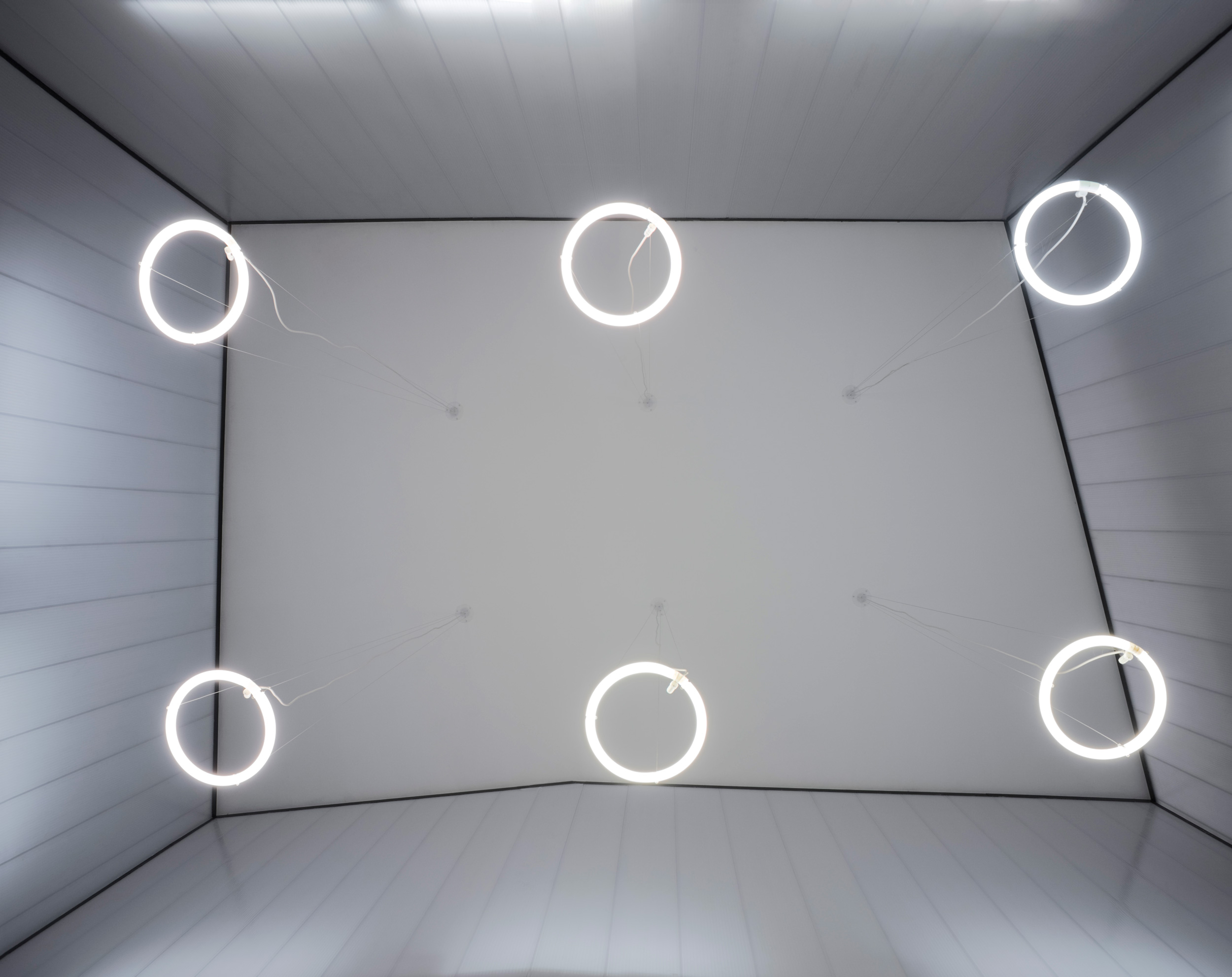 The third installation consist of the general lighting of the interior space. Its a grid of ring lamps floating in the space, that multiply their effect with the reflection effects, creating a magical atmosphere. 