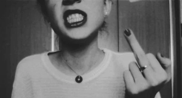 BLOG_%22Screw Beuatiful%22_Girl-Showing-Teeth-And-Middle-Finger-Image.jpg