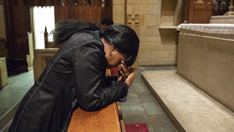 (Oneita Thompson prays in the sanctuary of the First United Methodist Church of Germantown. She and her husband, Clive, are from Jamaica and were living in South Jersey since 2004 before receiving deportation orders and seeking sanctuary at the church. Heather Khalifa/ Philadelphia Inquirer)
