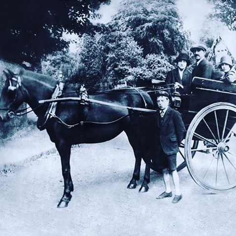 Circa 1925, Tom, our founders great grandfather and his horse he used as a carrier.