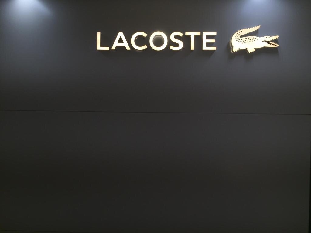 Lacoste UK HQ office sign - project management, quantity surveying and cdm services
