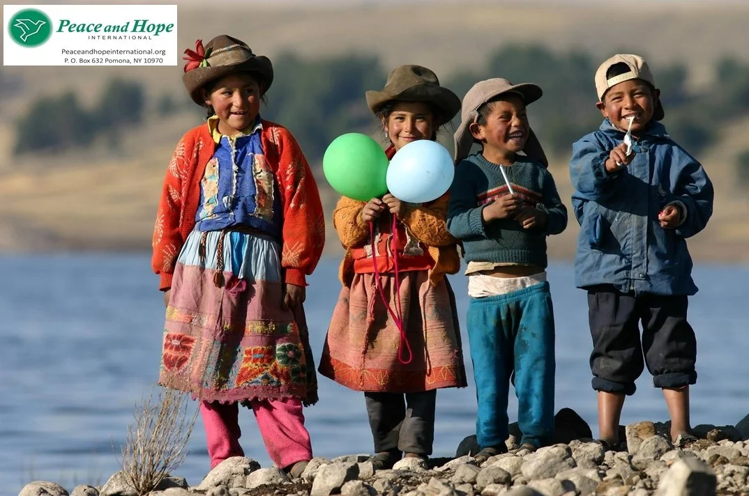A group of Peace and Hope's young Quechua beneficiaries celebrate together in Andahuaylas, Peru. Photo Credit: Peace and Hope International