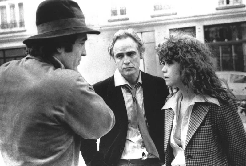 Director Bertolucci, Brando and Schneider discussing scene from “Last Tango in Paris”