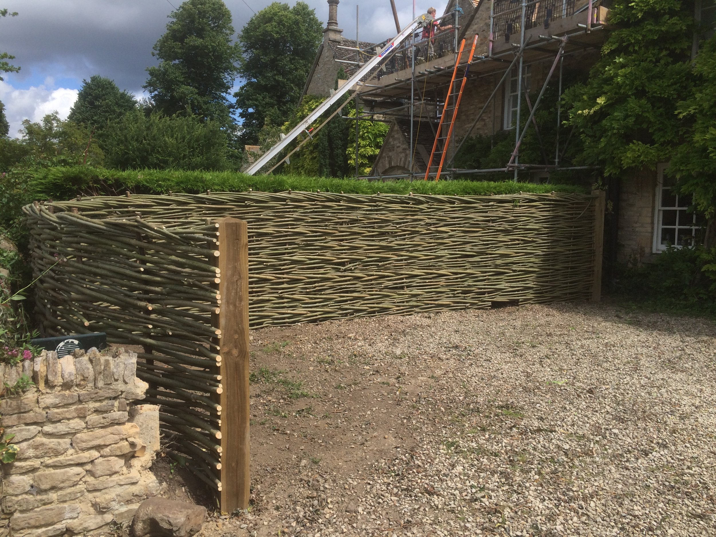 A natural woven willow fence