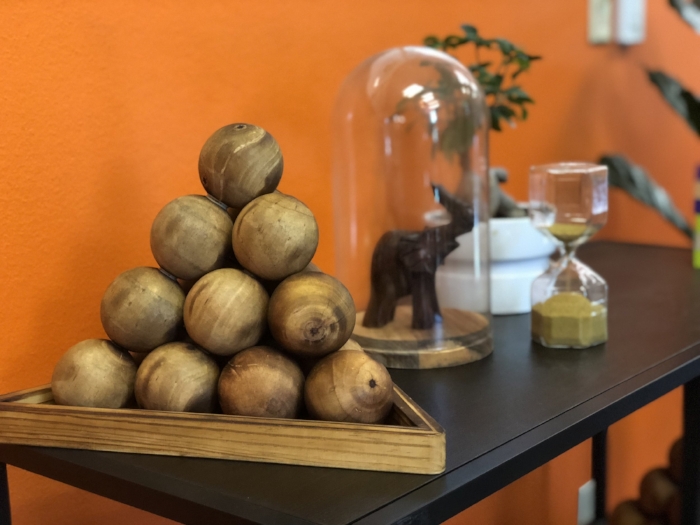 Pictured: Pod Puzzle, next to a banzai tree and glassed elephant in a front entryway.