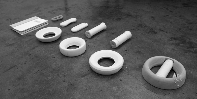 A cylinder was chosen to fit technical components of the audio device, the ring shape is the docking "speaker" for at home. 