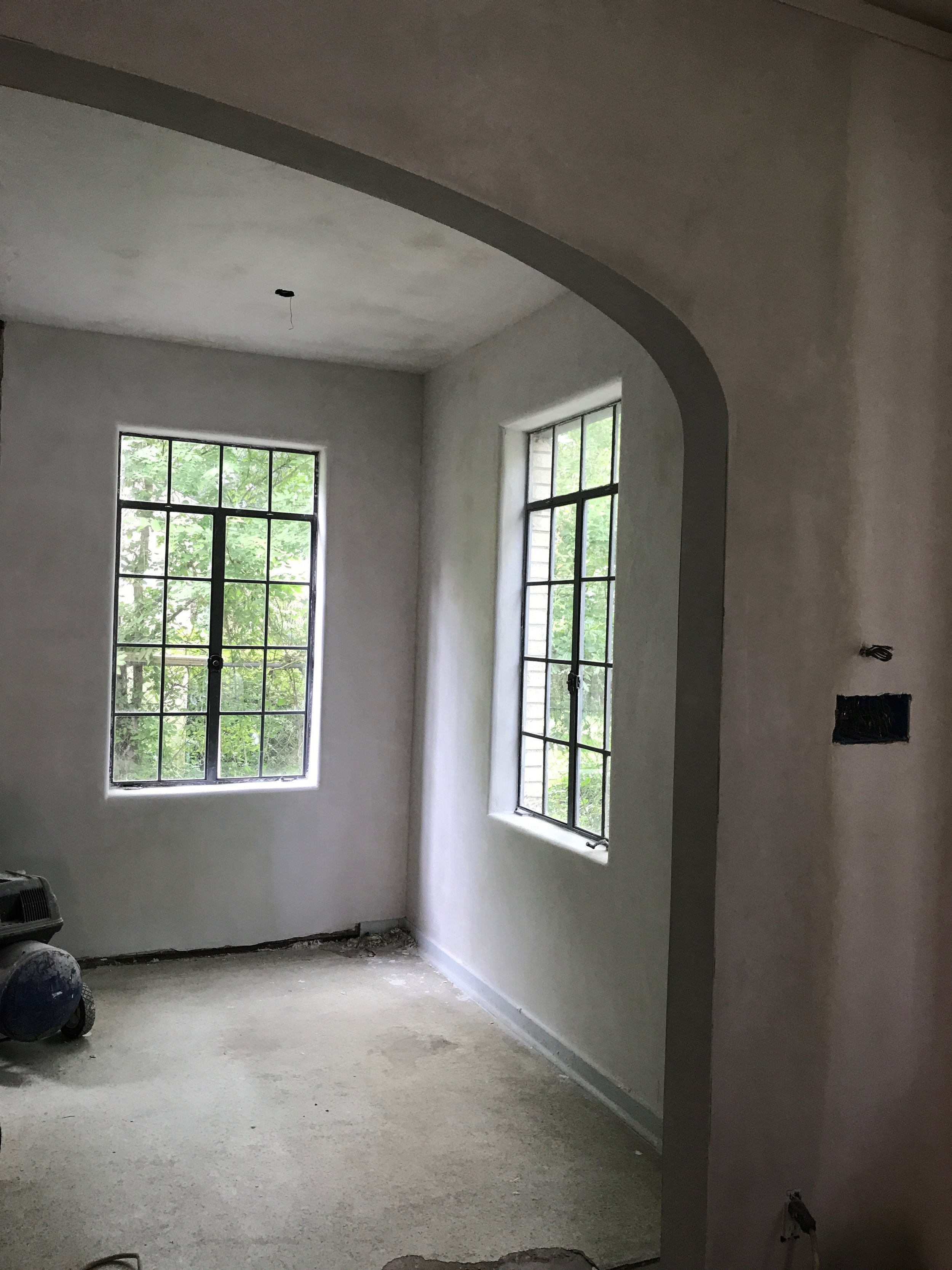 plasterwork done in the arch and kitchen! banquette goes in this corner!