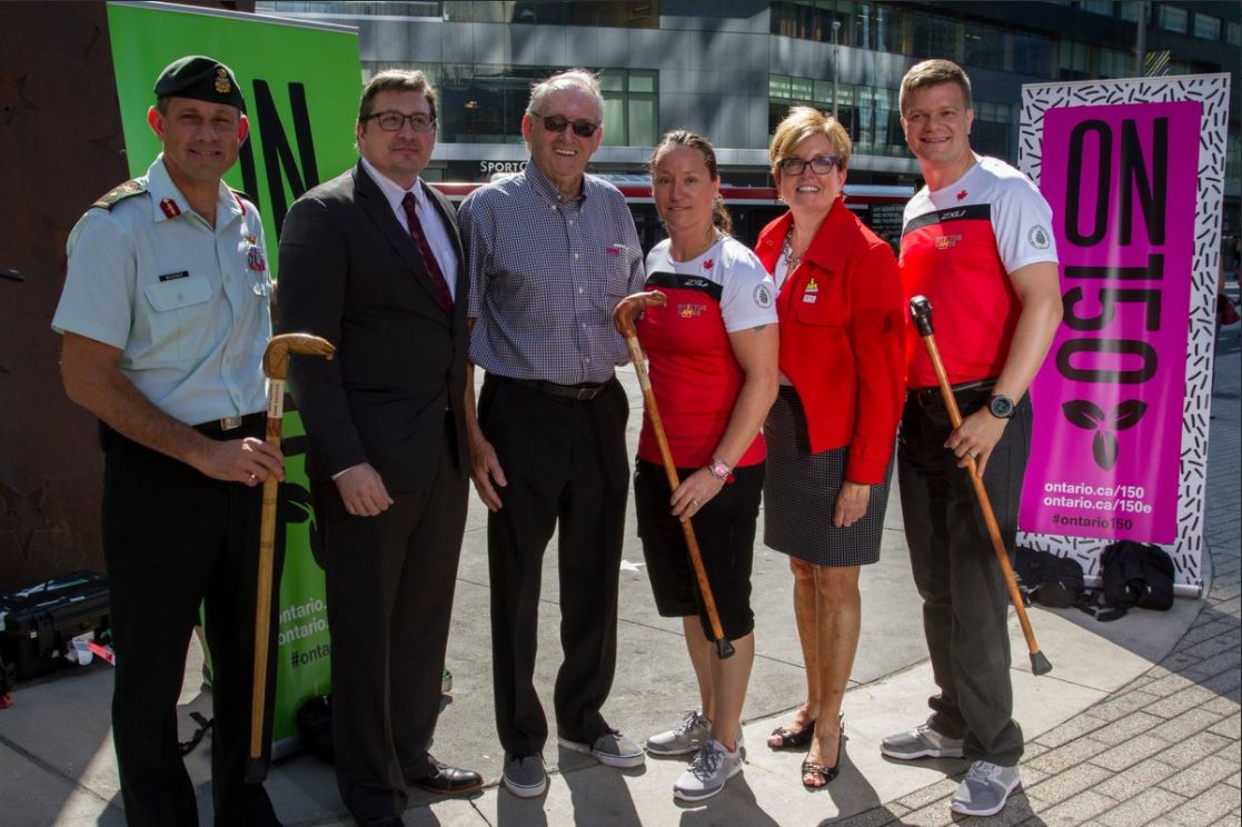 From left, Chef de Mission and Brig.-Gen. Mark Misener, Robert Steven, Art Gallery Burlington CEO, Ken Maitland, member of Burlington Sculptor and Woodcarves Guild, Team Canada co-captain Retired Master Cpl. Natacha Dupuis, Burlington MPP and Minister of Tourism, Culture and Sport Eleanor McMahon, and Team co-captain Maj. Simon Mailloux at the official welcoming of Team Canada to the 2017 Invictus Games at Maple Leaf Square in Toronto on Sept. 21 where Canes for Veterans were also presented. - Michelle Cochrane photo