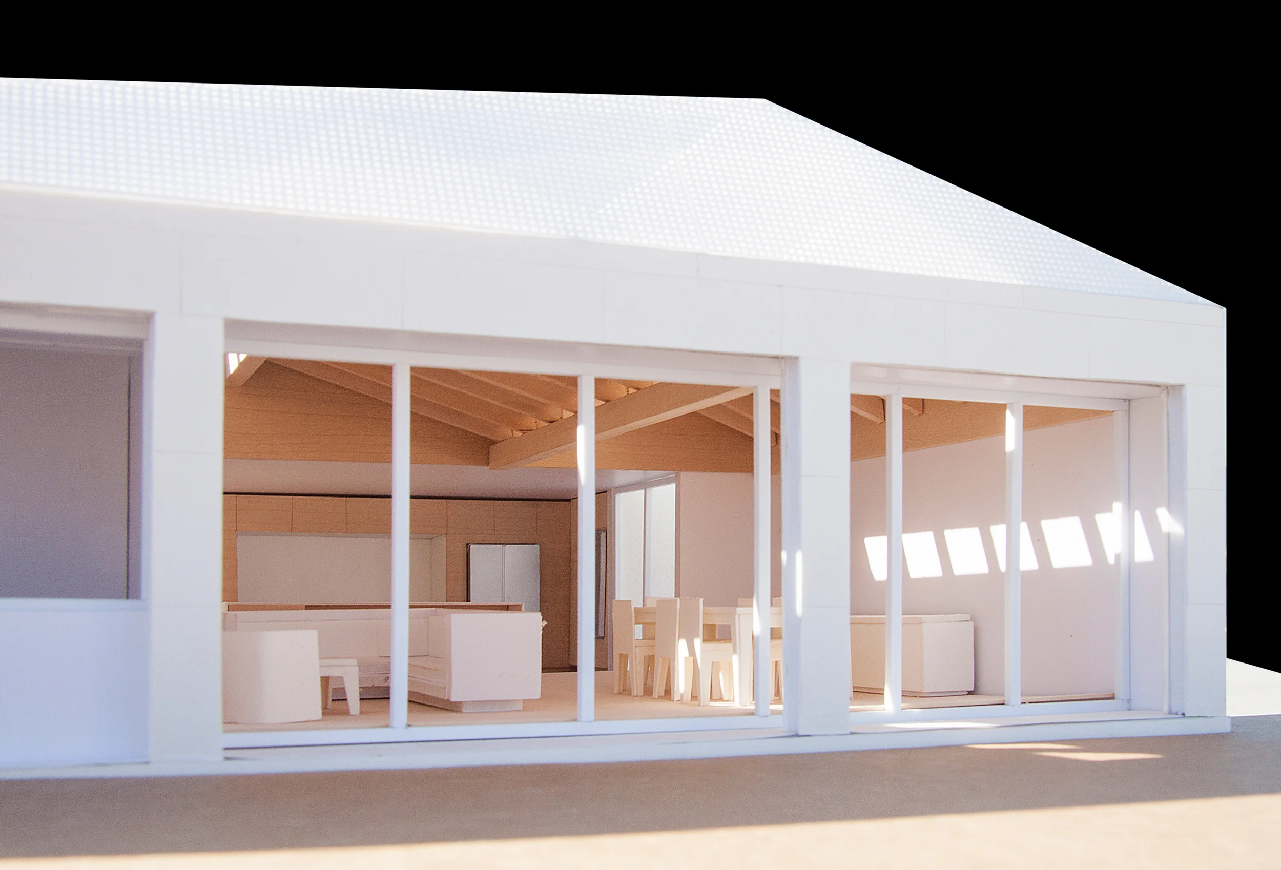 Photograph of model showing the skylights and wood clad vaulted ceiling with exposed beams.