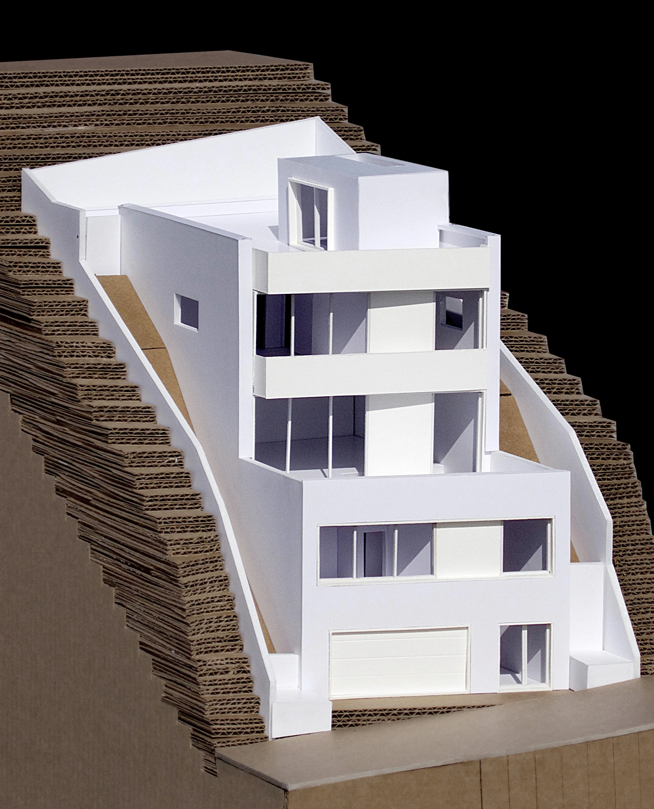 A model of the house with the street in the foreground.