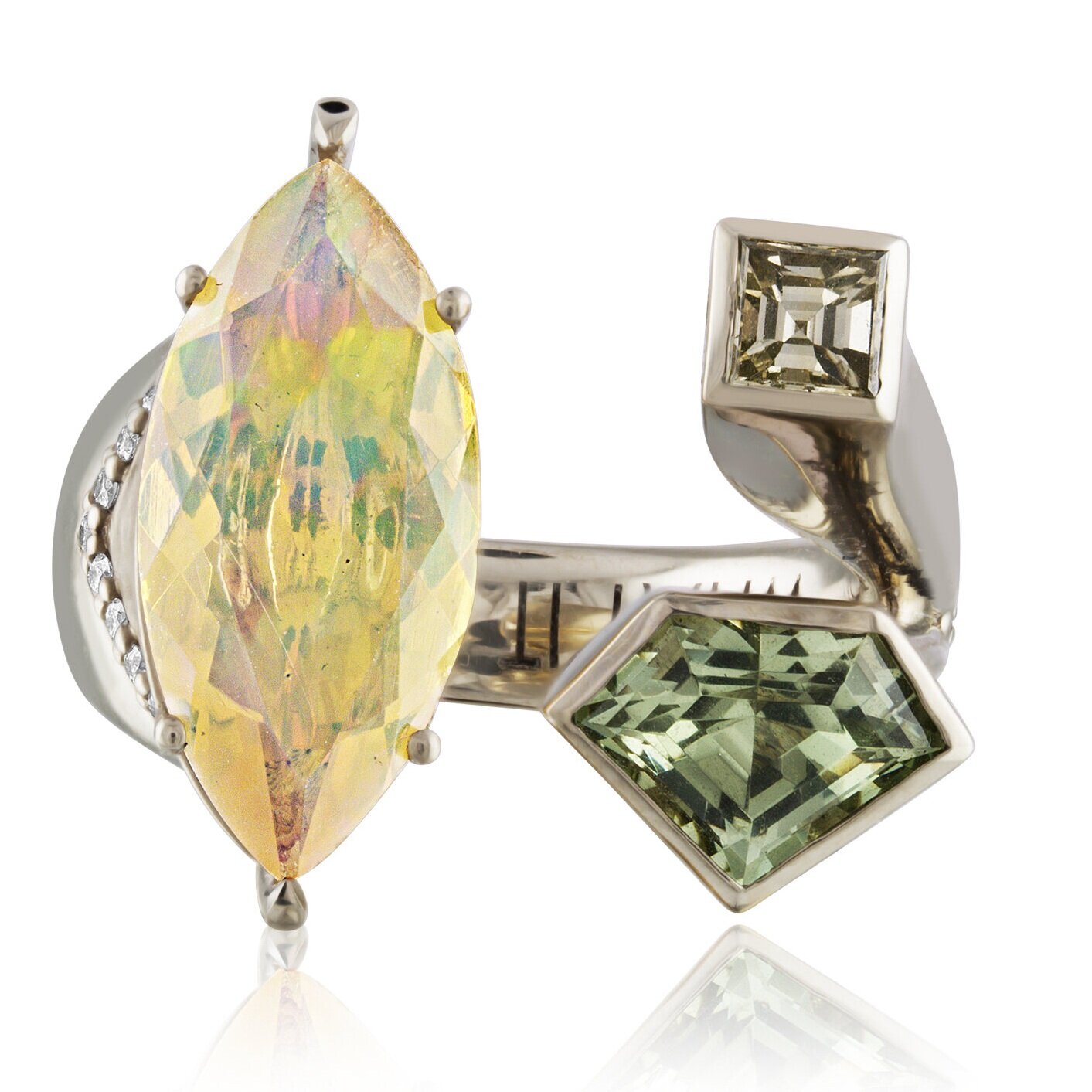 Julie's power ring: her WHAT IT TAKES RING designed for AGTA's Spectrum Awards 2019. Opal for fire and passion, Diamonds for strength, Green Garnet shield protects finances and stimulates growth.