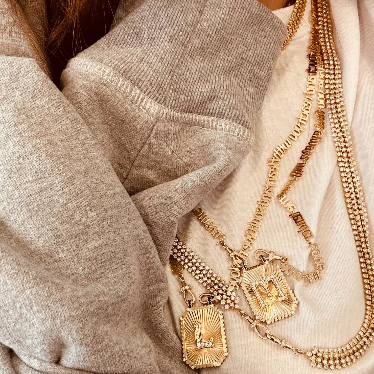 Marie's everyday jewelry: her custom diamond letter scapulars
