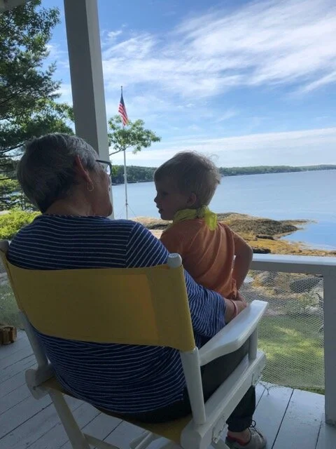 Photo on the porch of Robin with my grandson