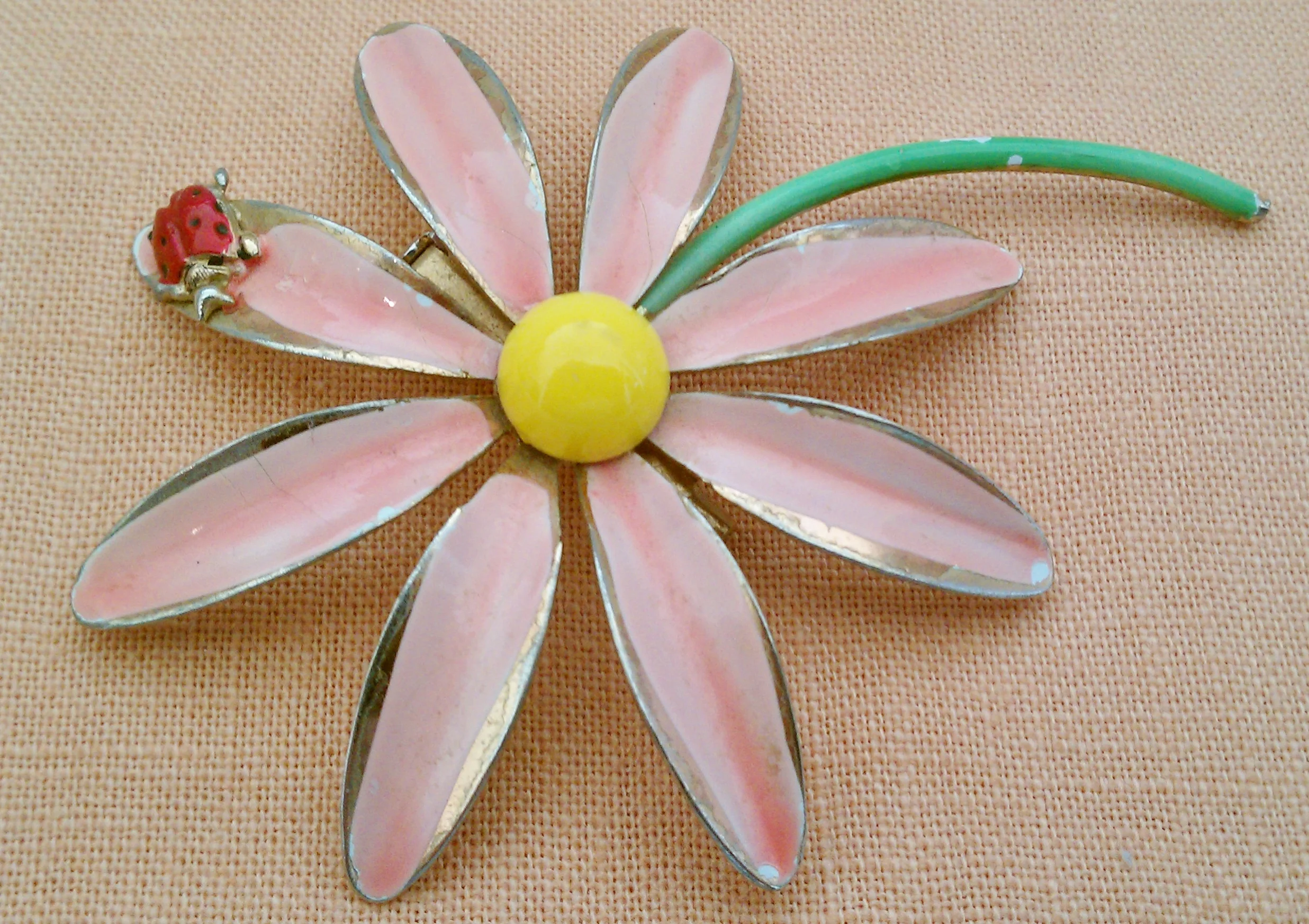 This pink daisy is from the mid 1950s and was always a favorite. In the 1960s I loved wearing this daisy on a pretty pink Villager dress with the typical pin-tucked bodice and little collar.