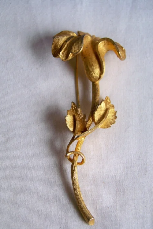 I have had this BSK gold flower pin since the mid 1950s.