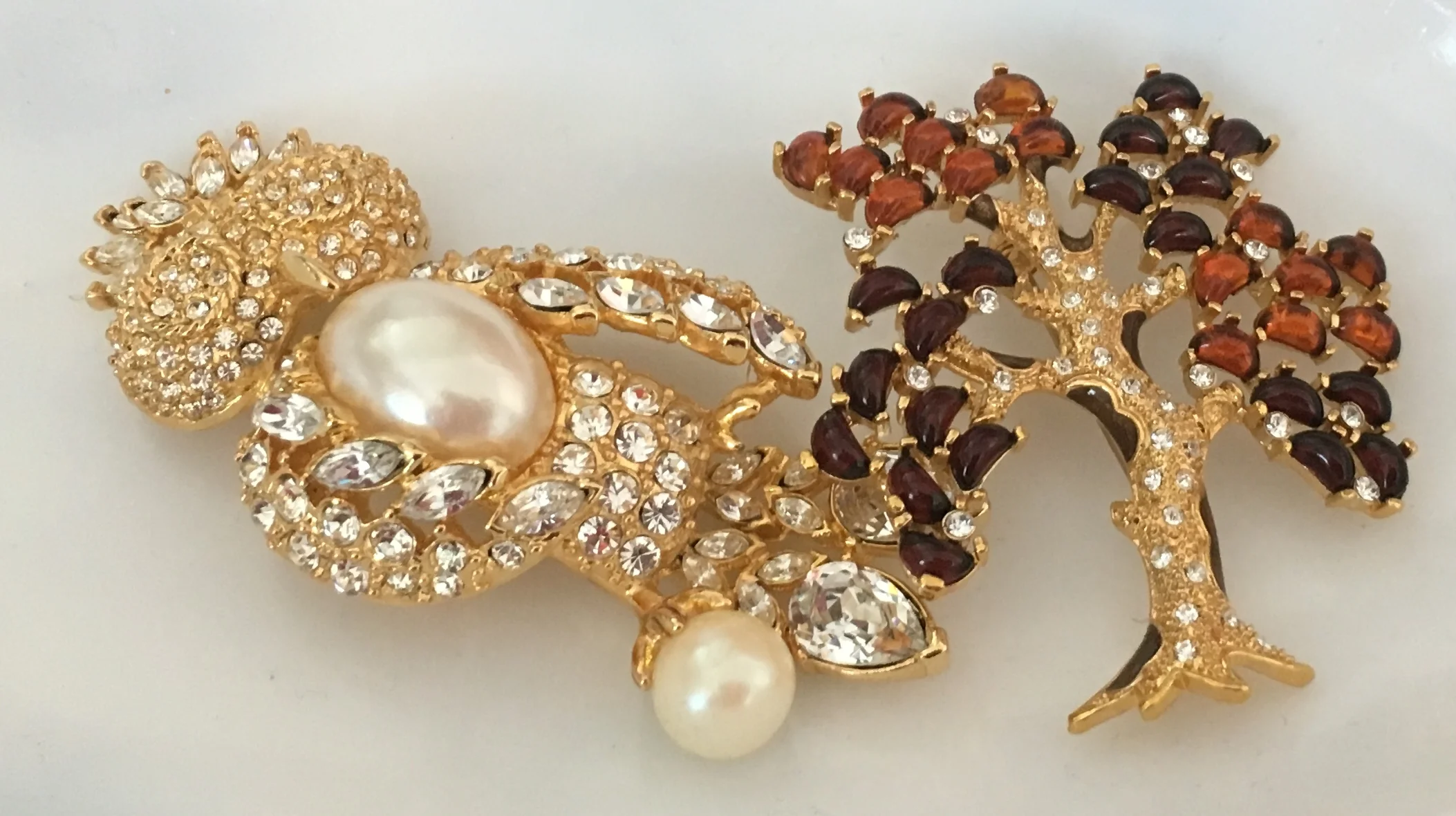 Reproduction brooches from the Madeline Albright pin show ... Owl and a tree