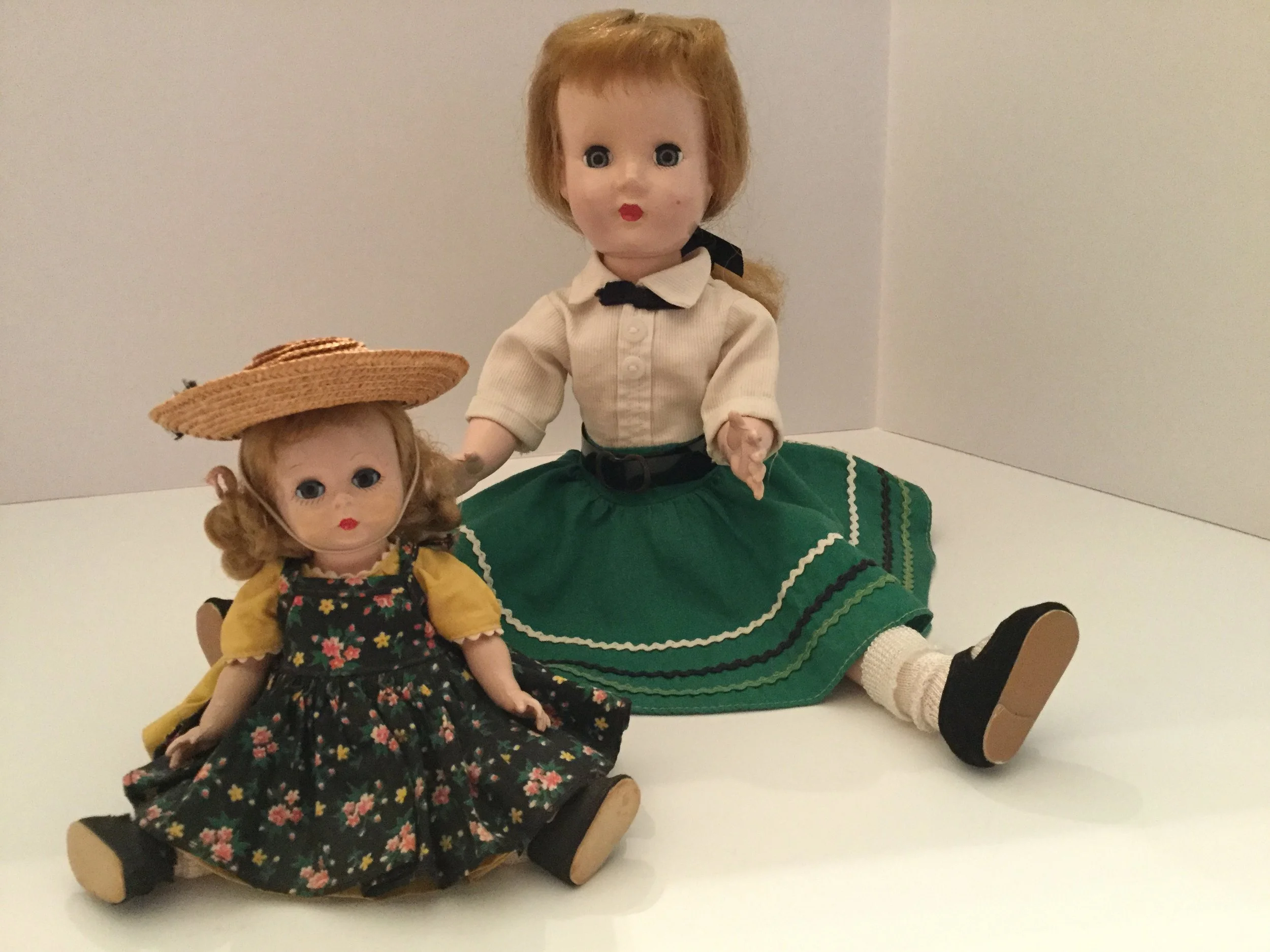My 1952 14" Effanbee Honey walker doll ... typical 1950s circular skirt with rick rack. My 1953 8" Madame Alexander-kin Wendy doll. 