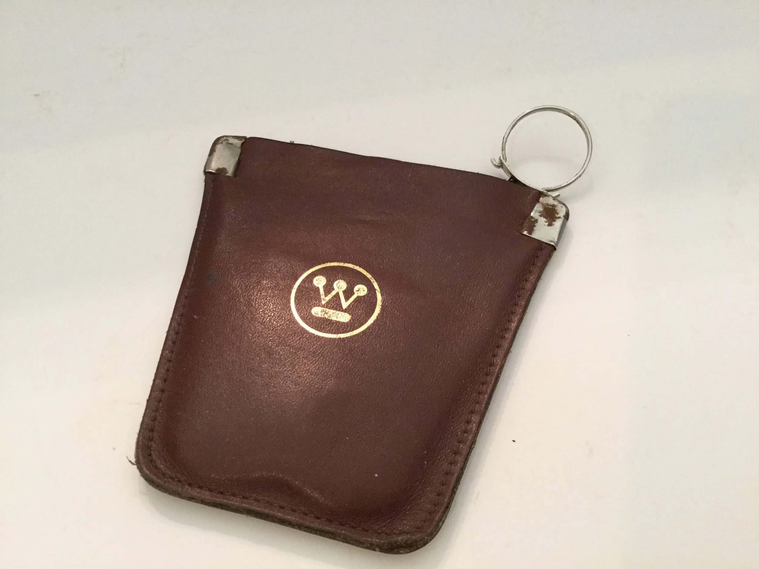 A leather change purse and key chain that I collected