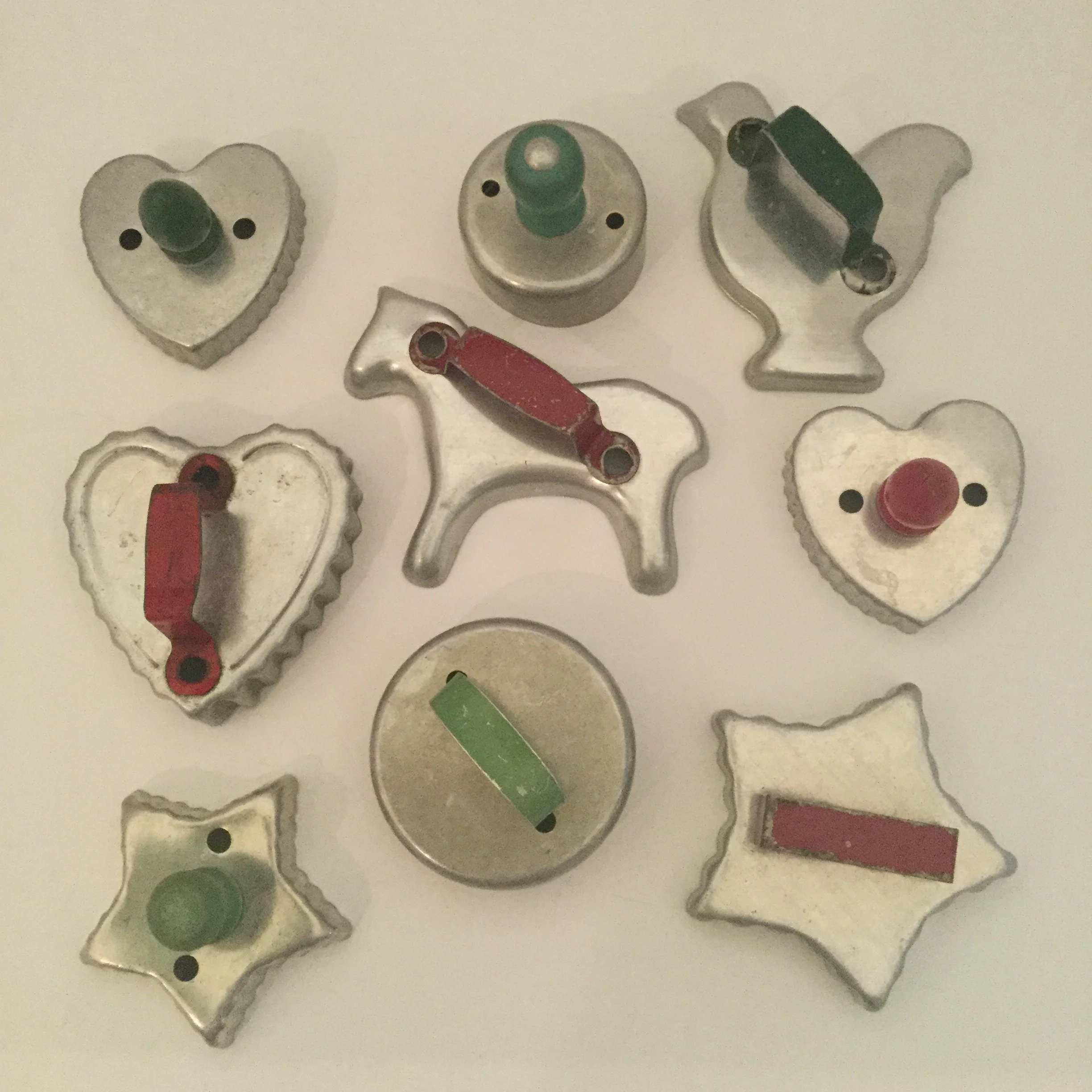My oldest red and green handled cookie cutters. The green handled chicken and biscuit cutters belonged to my mother.