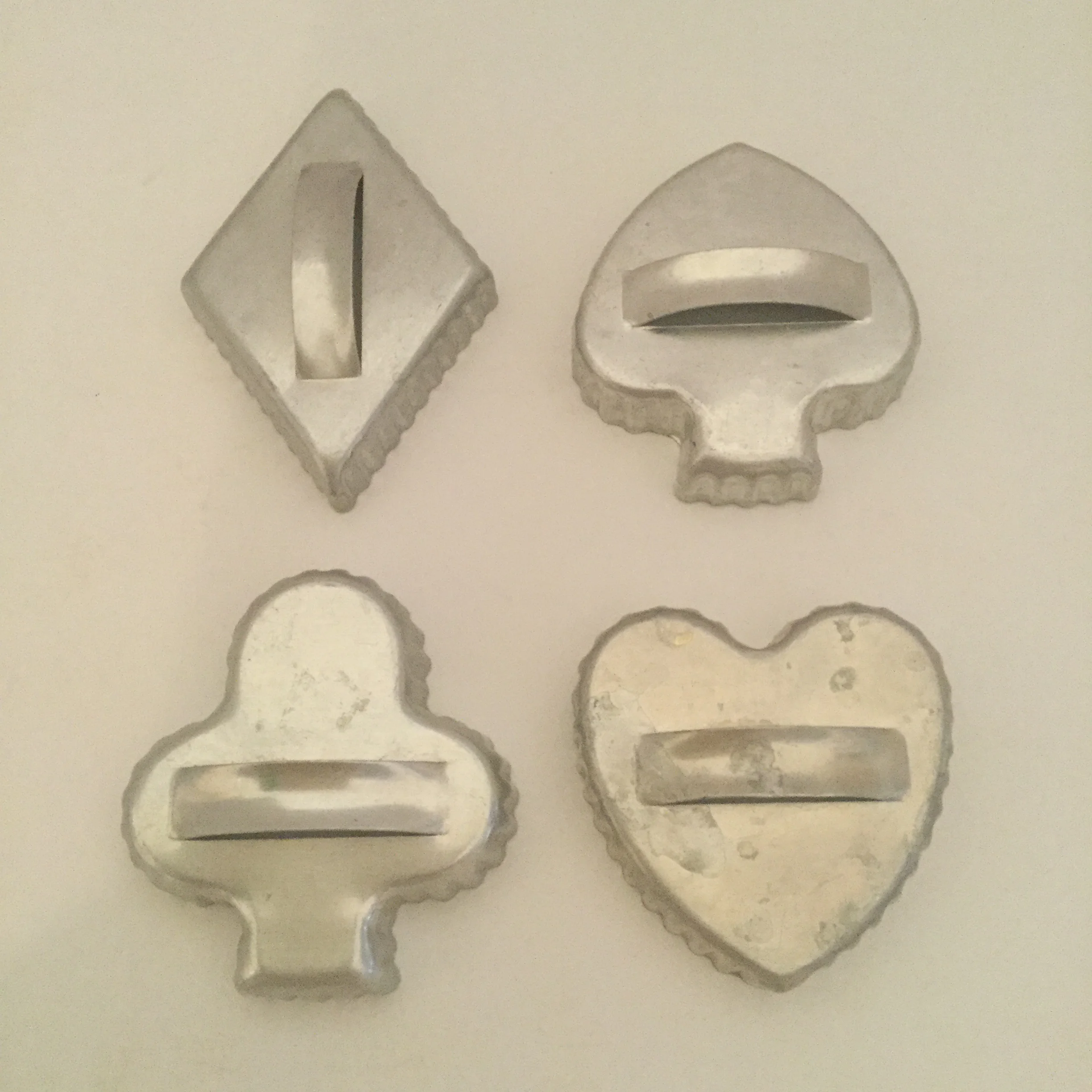 Card suits cutters ... the spades and clubs are harder to find. These were popular for Bridge parties either for cookies or for tea sandwiches.