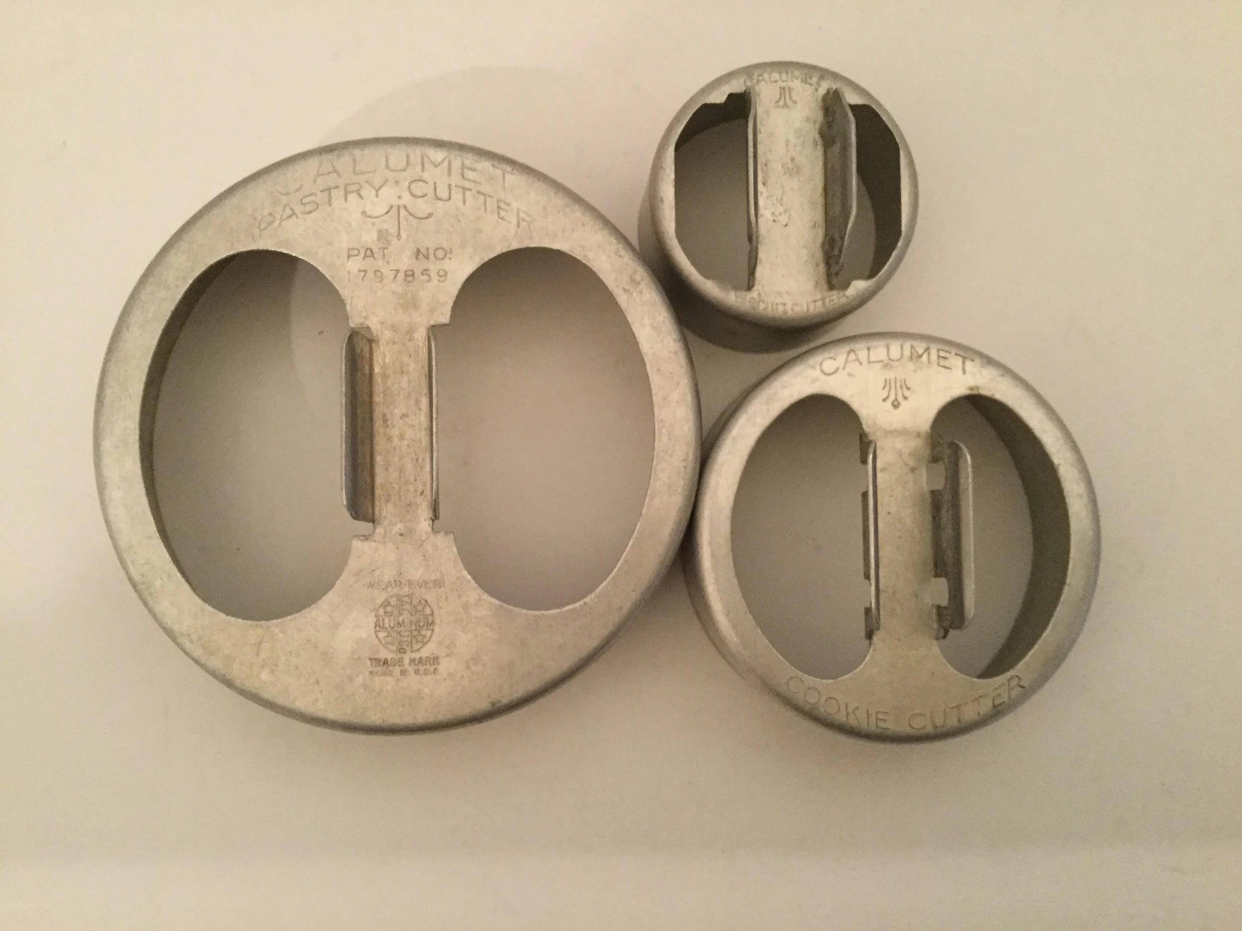 The three Calumet cookie cutters ... large cutter is a pastry cutter, the middle cutter is a cookie cutter, and the small cutter says biscuit cutter.